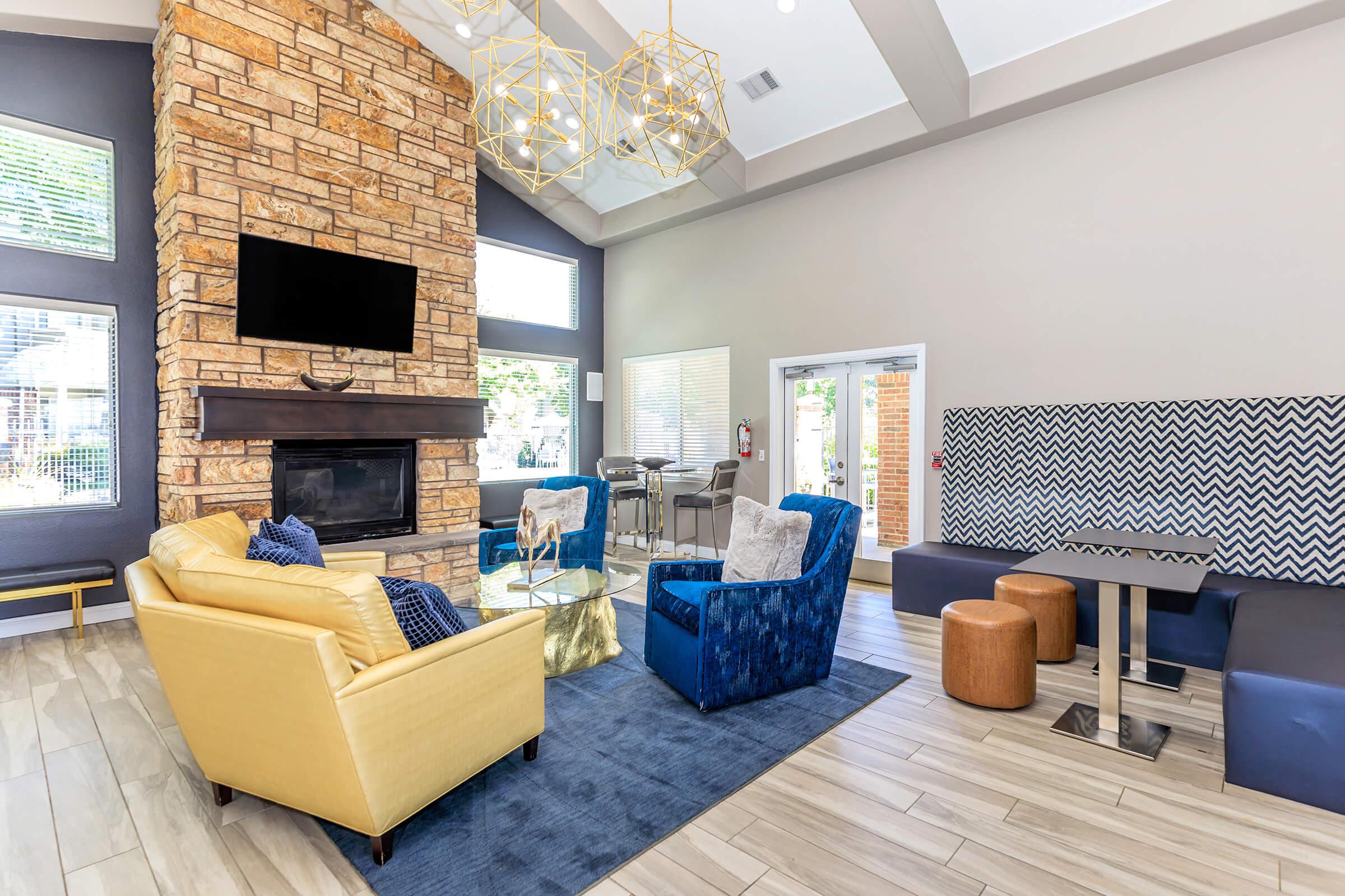 a living room filled with furniture and a fireplace