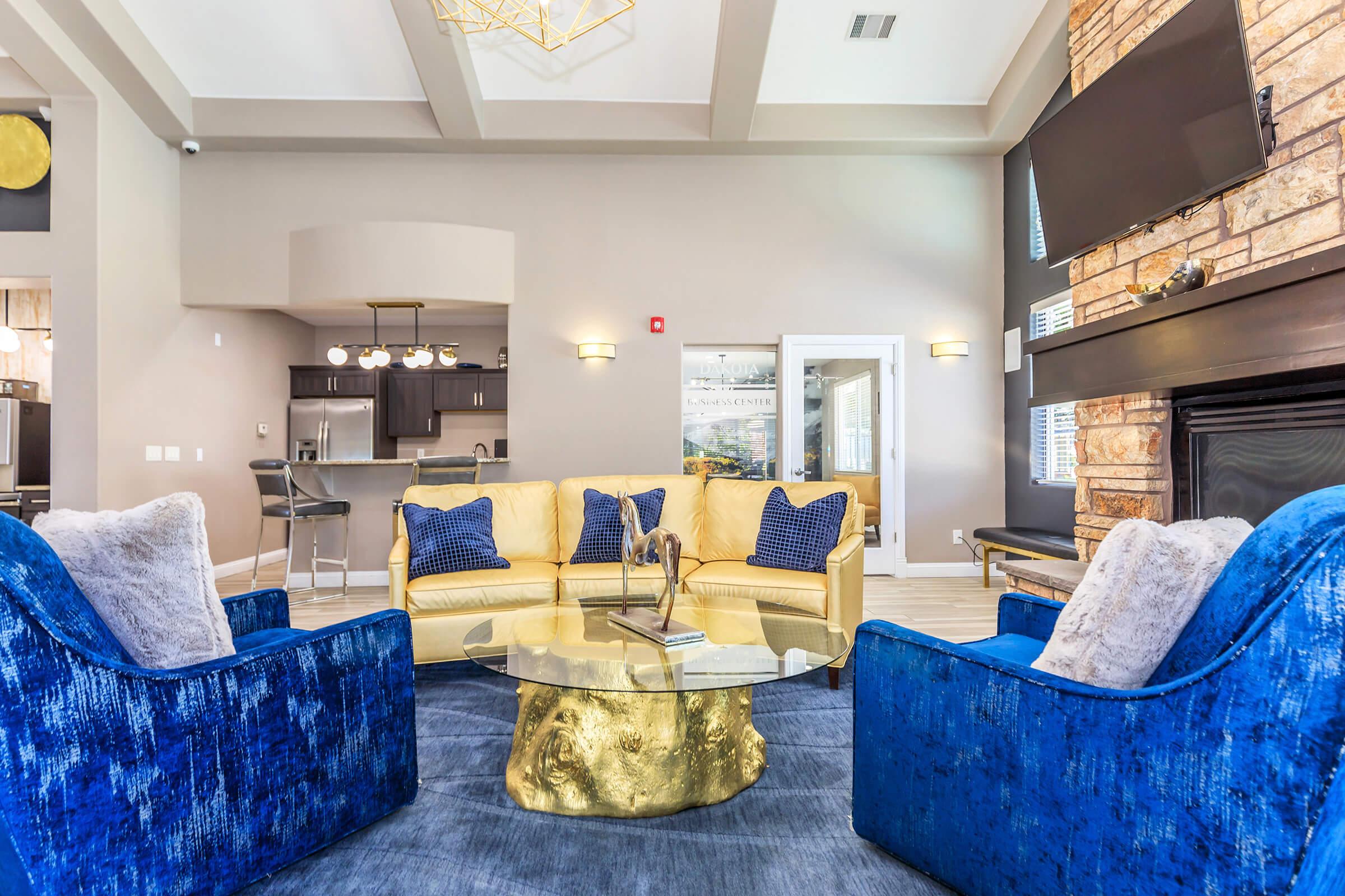 a living room filled with furniture and a fireplace