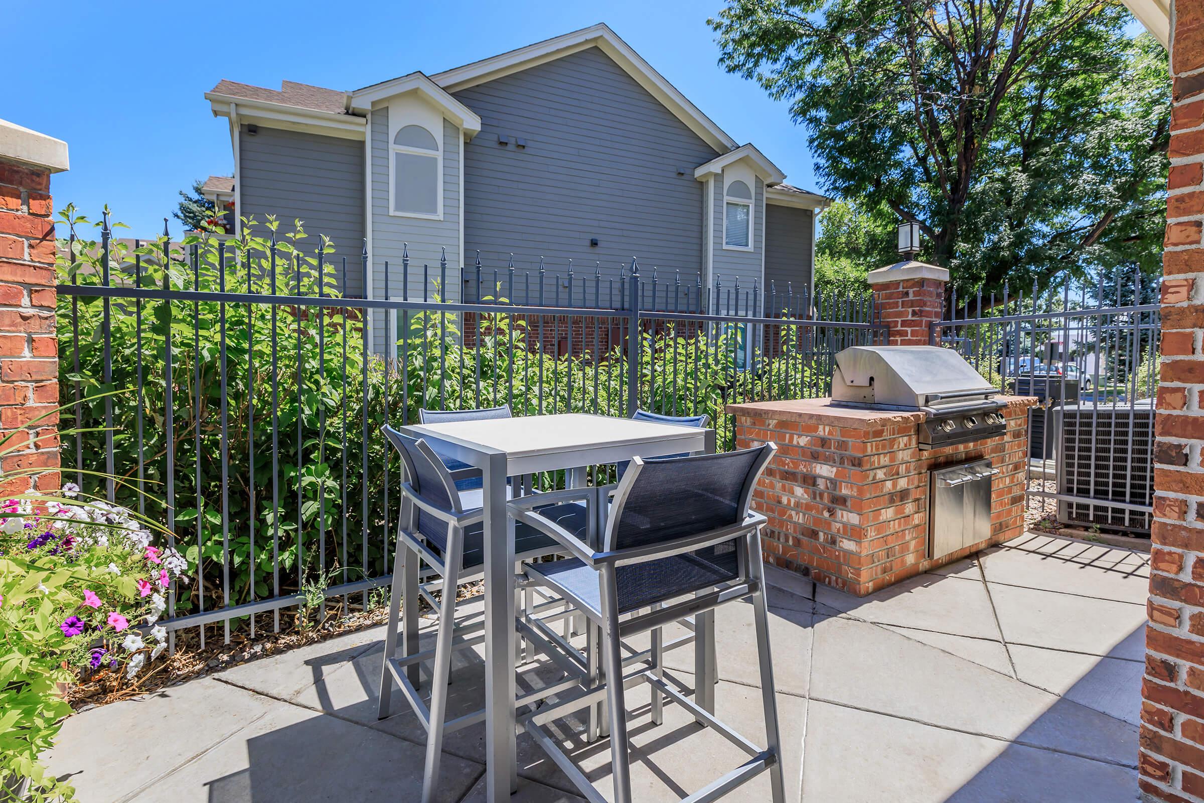 a bench in front of a brick building