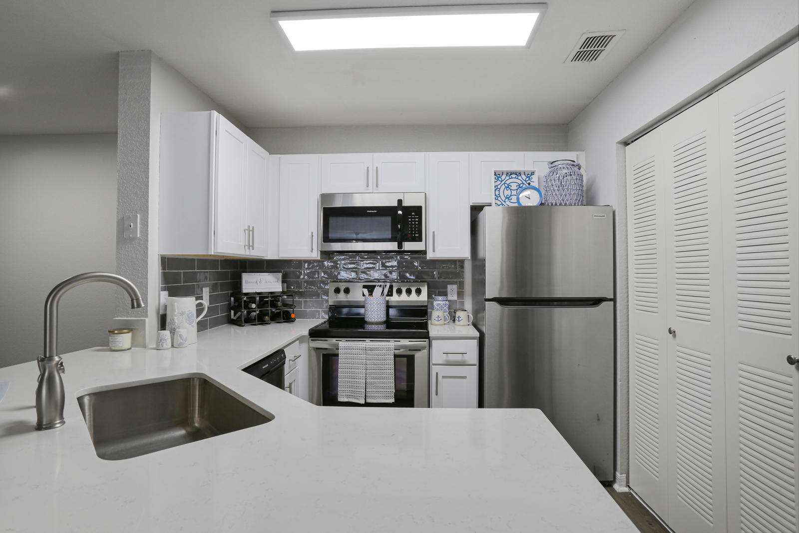 a kitchen with a sink and a microwave