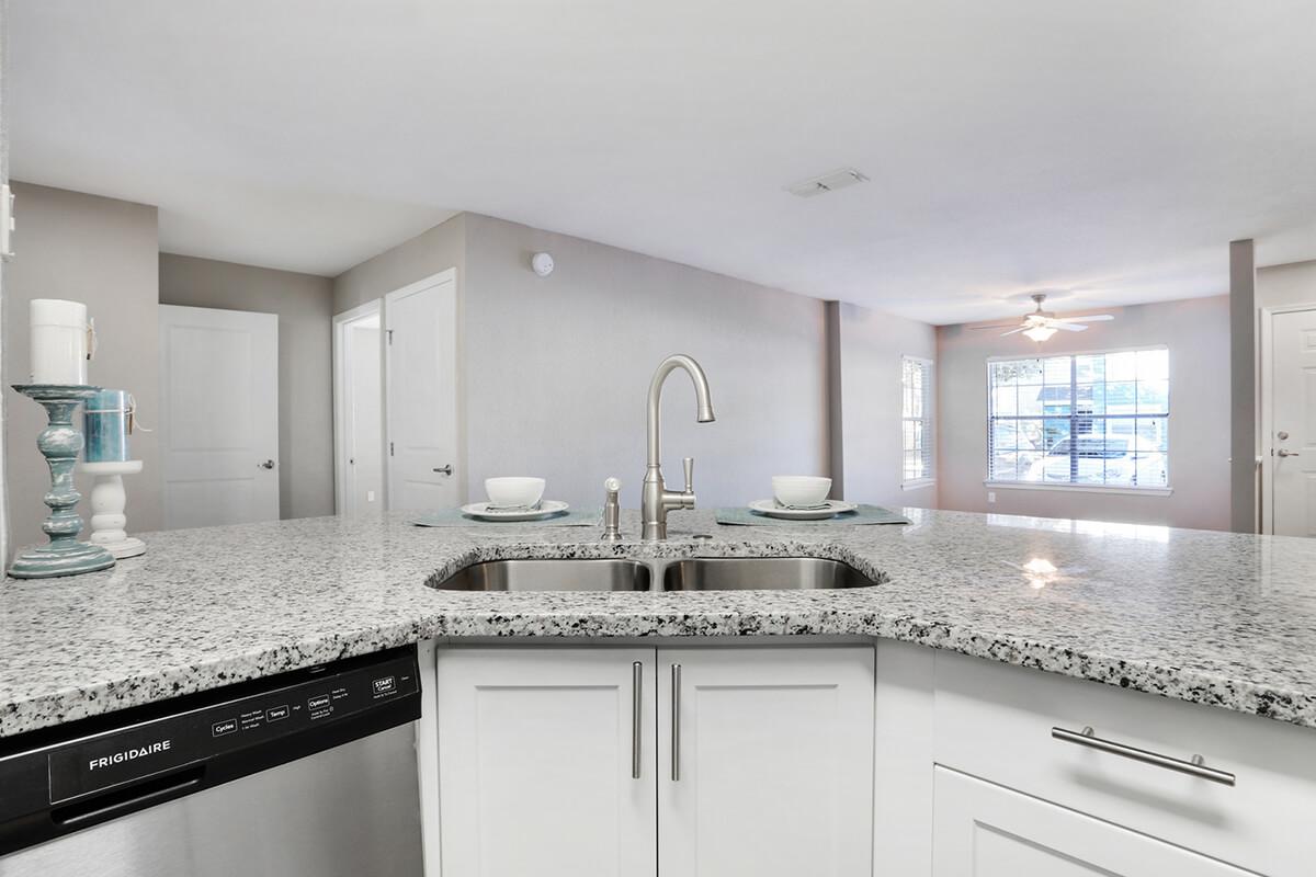 a kitchen with a sink and a window