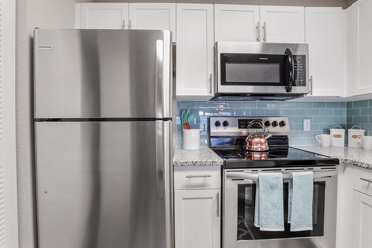 a kitchen with a stove top oven sitting inside of a refrigerator