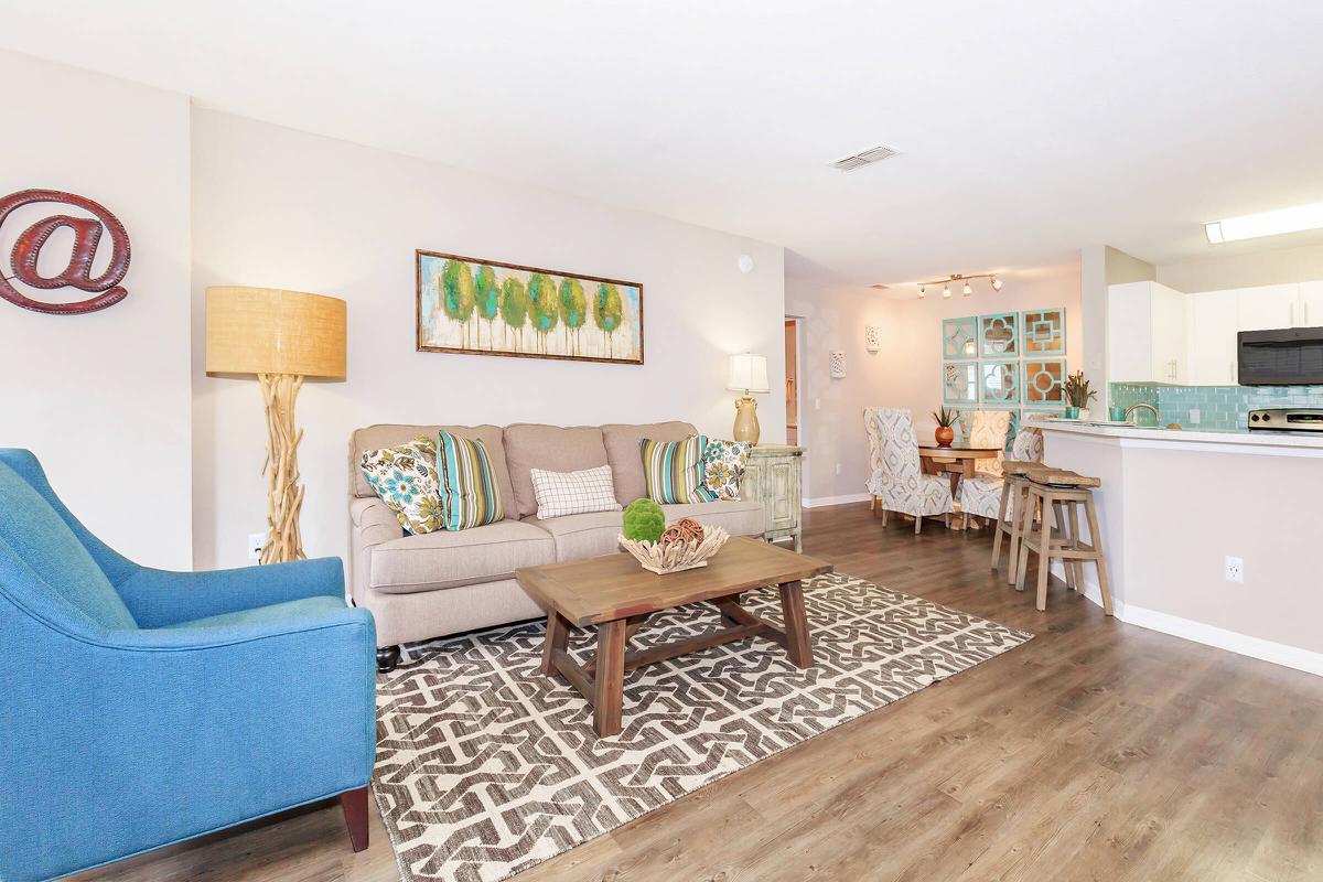 a living room filled with furniture and a fireplace