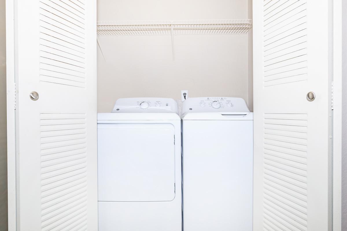 a white refrigerator freezer sitting next to a door