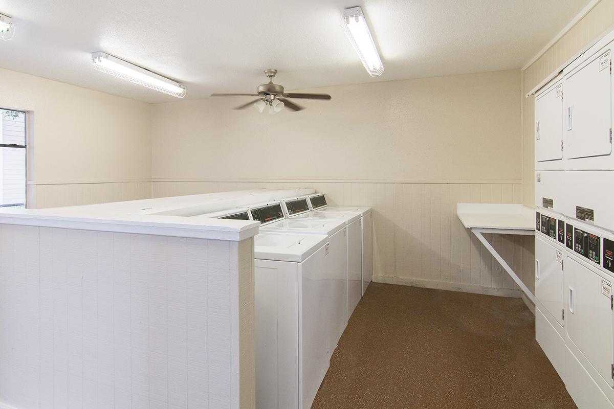 a kitchen with white cabinets