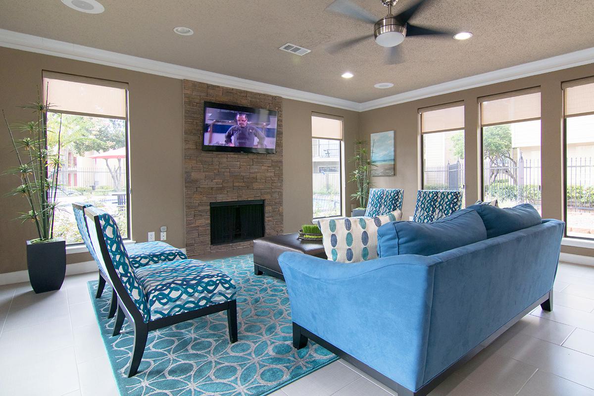 a living room filled with furniture and a large window