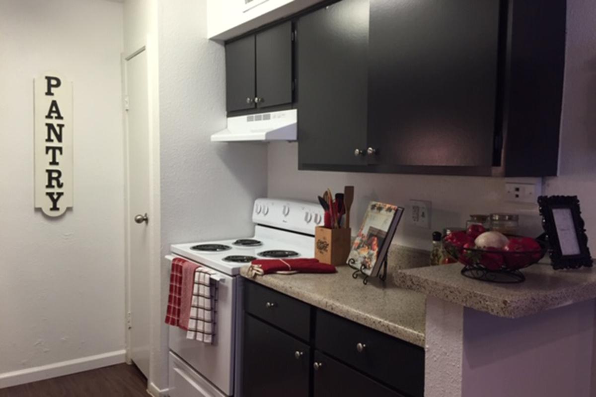 a kitchen with a sink and a refrigerator