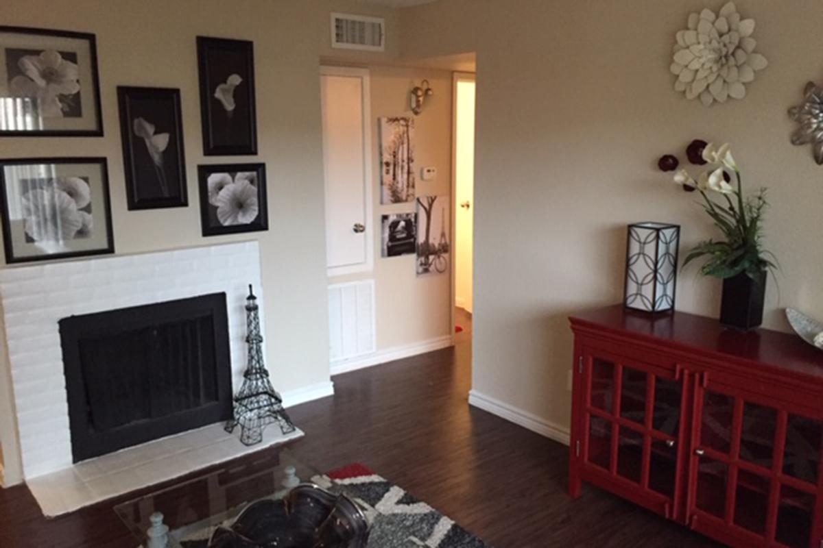 a living room filled with furniture and a fireplace