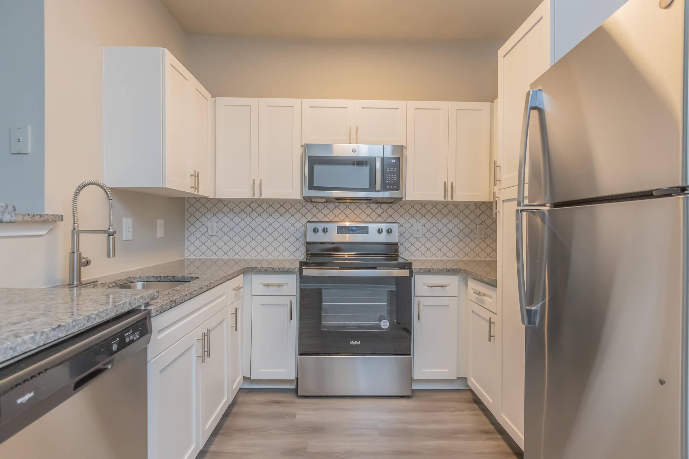 a stainless steel refrigerator in a kitchen