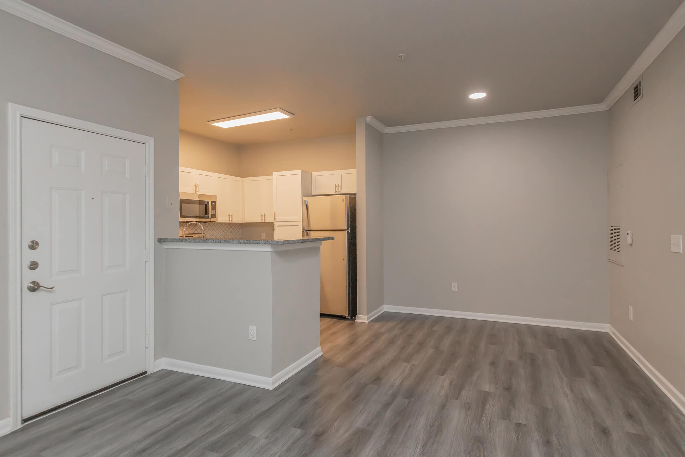 a large empty room with a wood floor