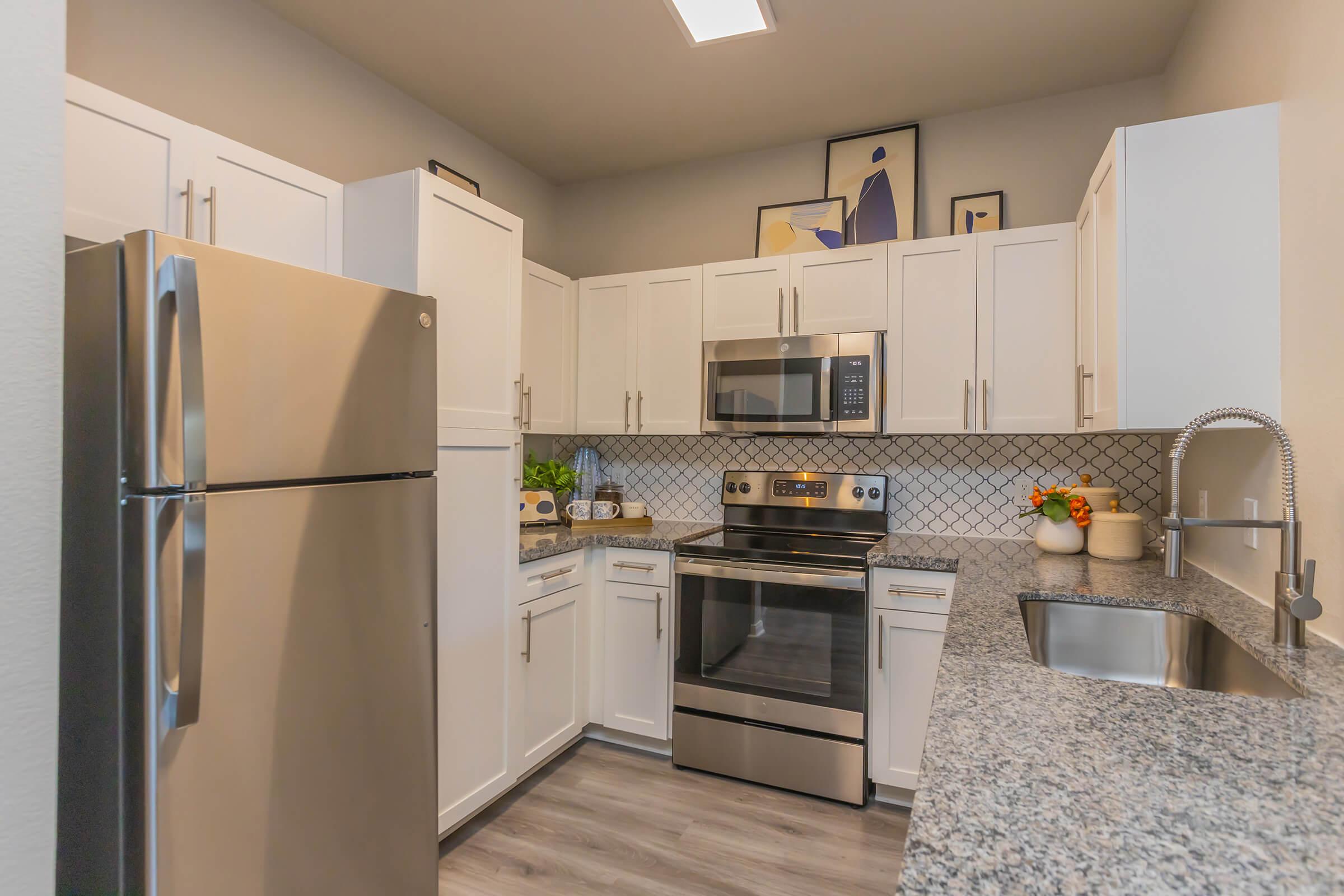 a stainless steel refrigerator in a kitchen