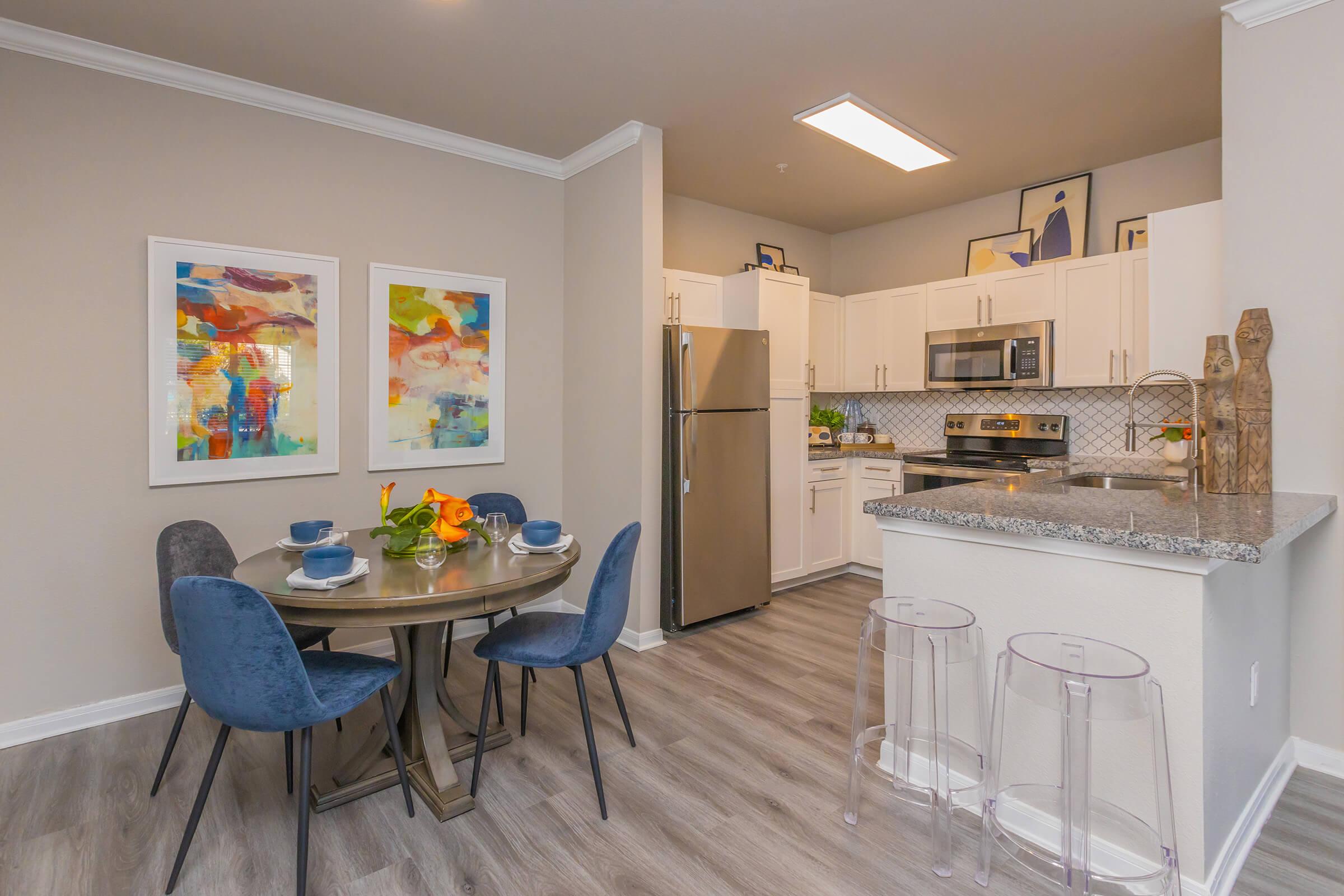 a kitchen with a table in a room