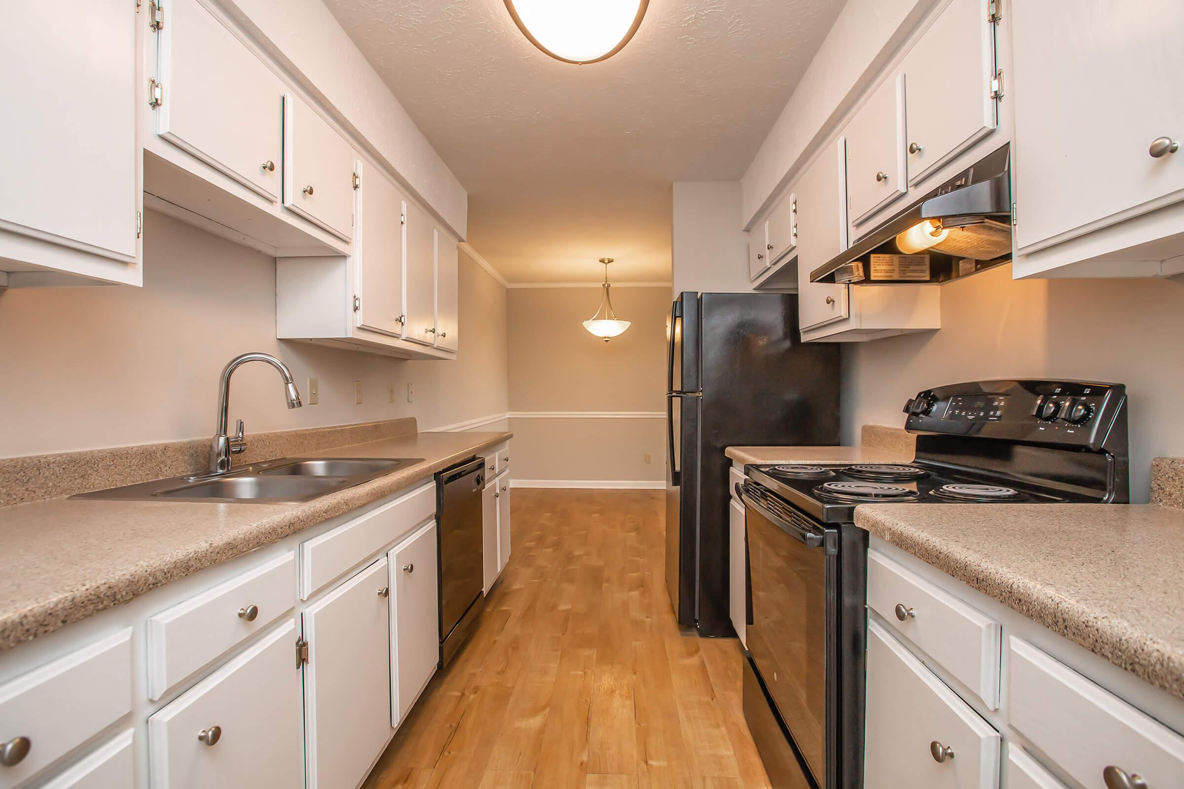 a large kitchen with stainless steel appliances