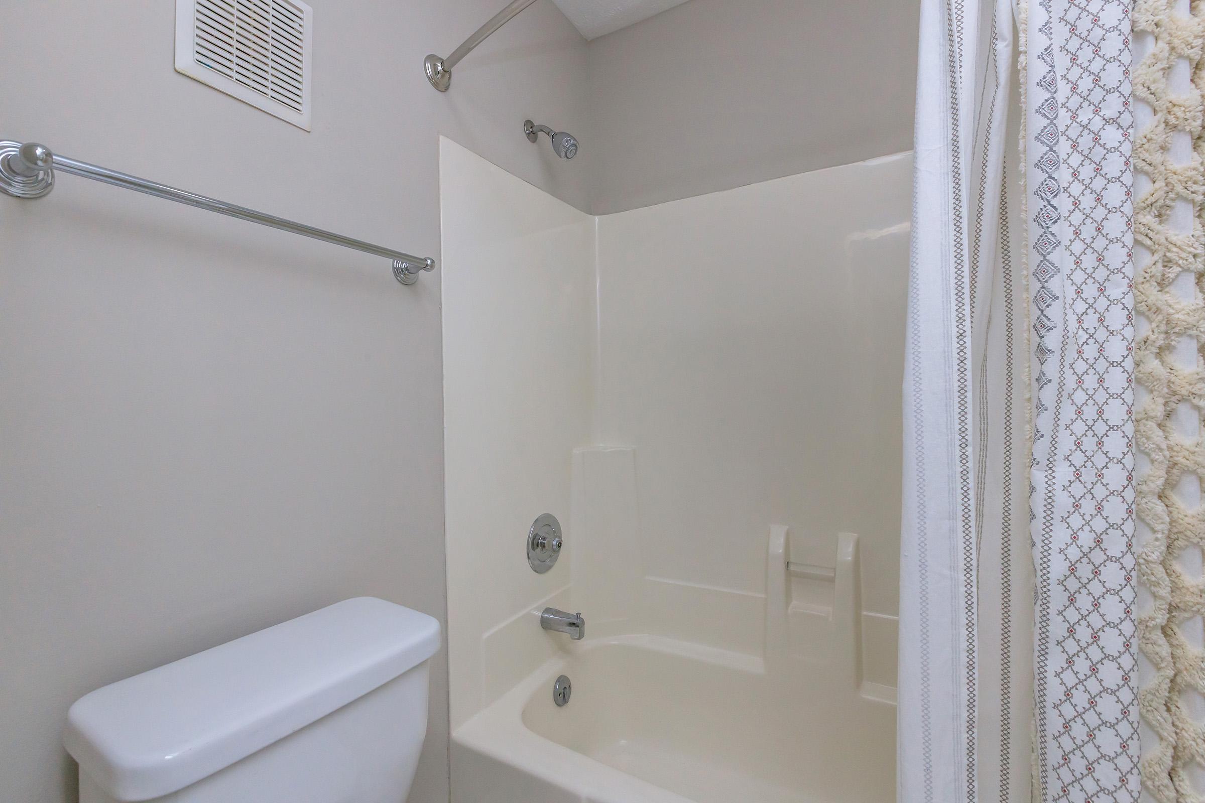 a shower that has a sink and a mirror