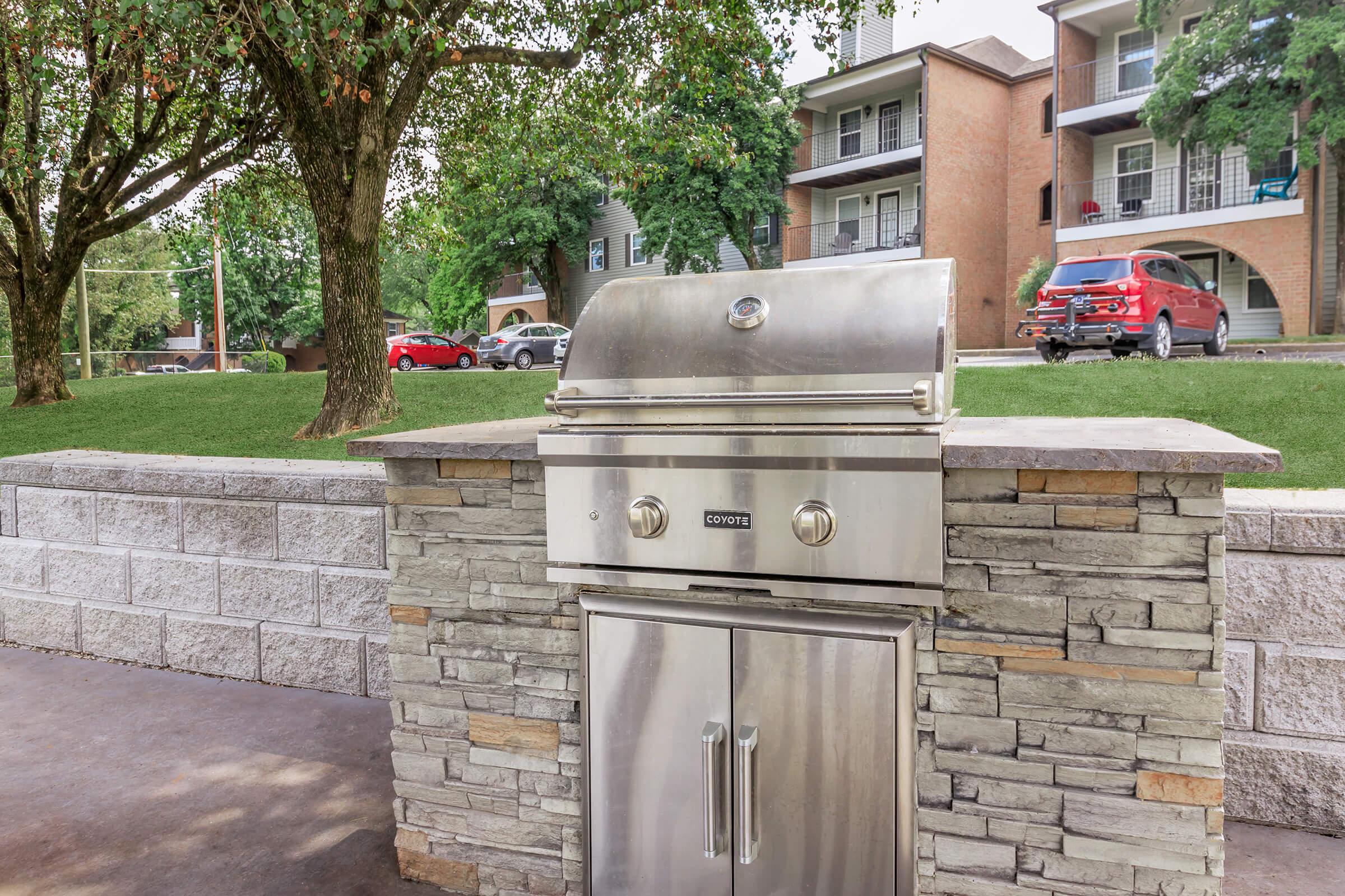 a close up of a stone building that has a stove and brick wall