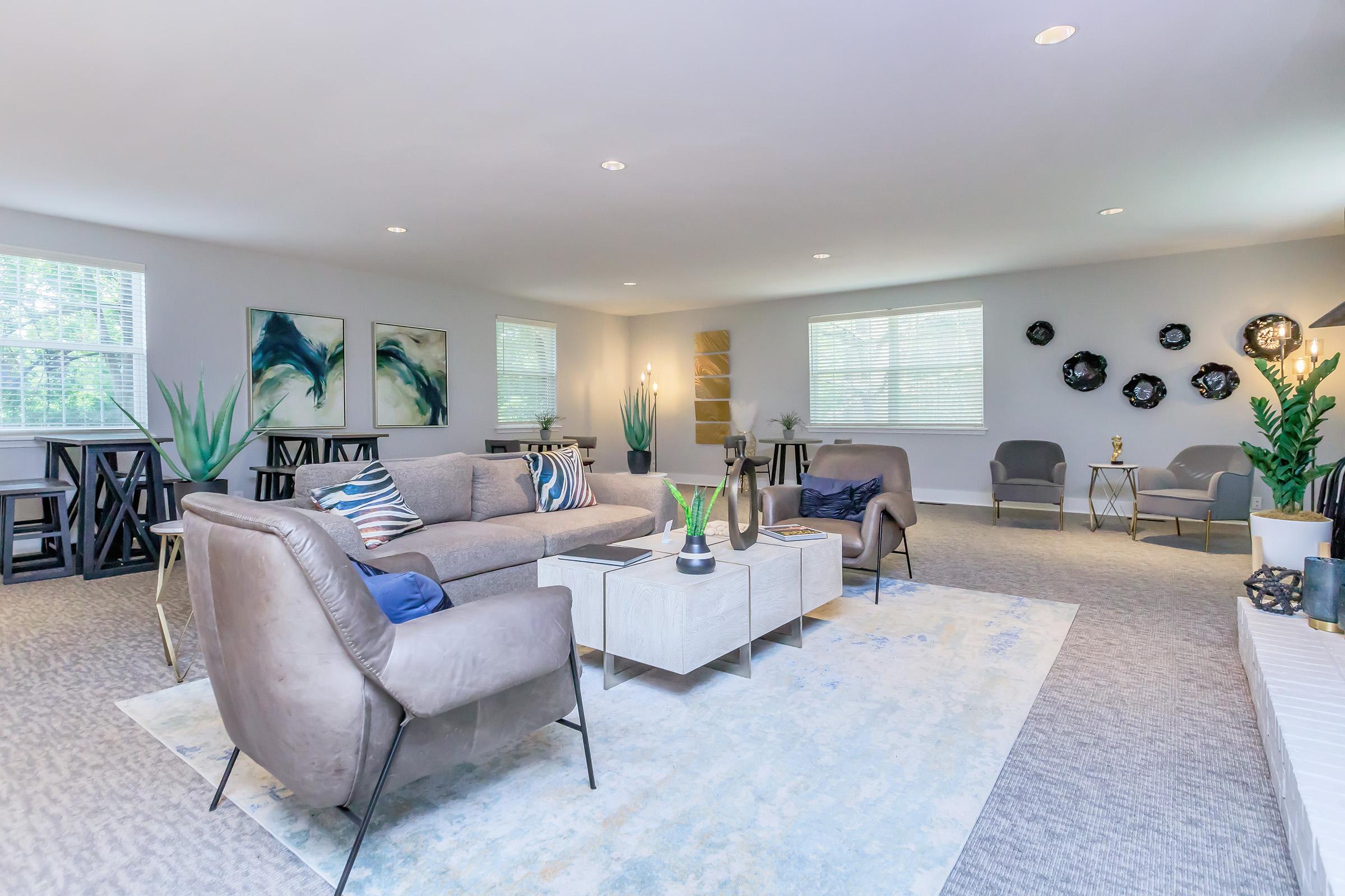 a living room filled with furniture and a flat screen tv