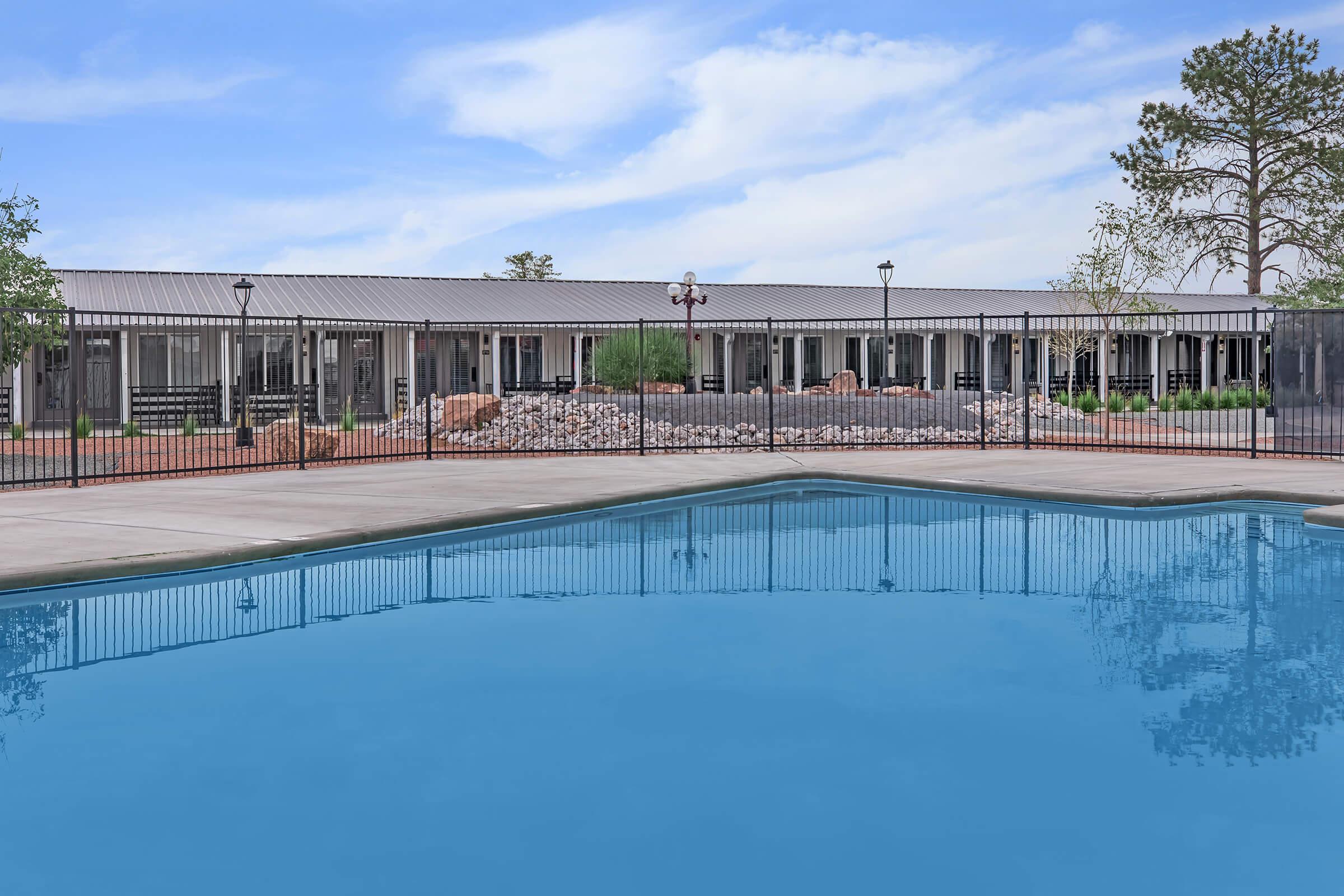 a pool next to a body of water