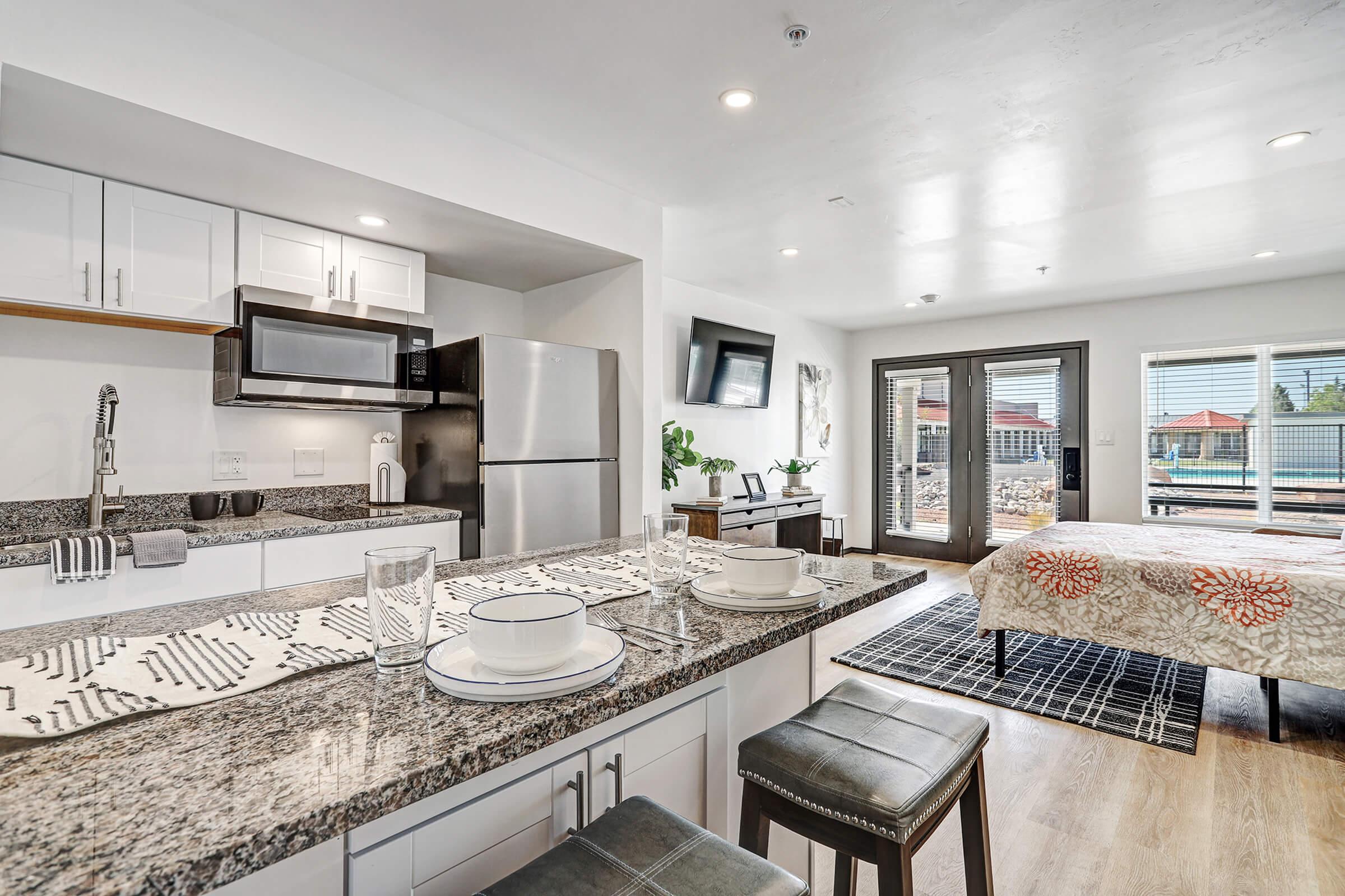 a large kitchen with stainless steel appliances