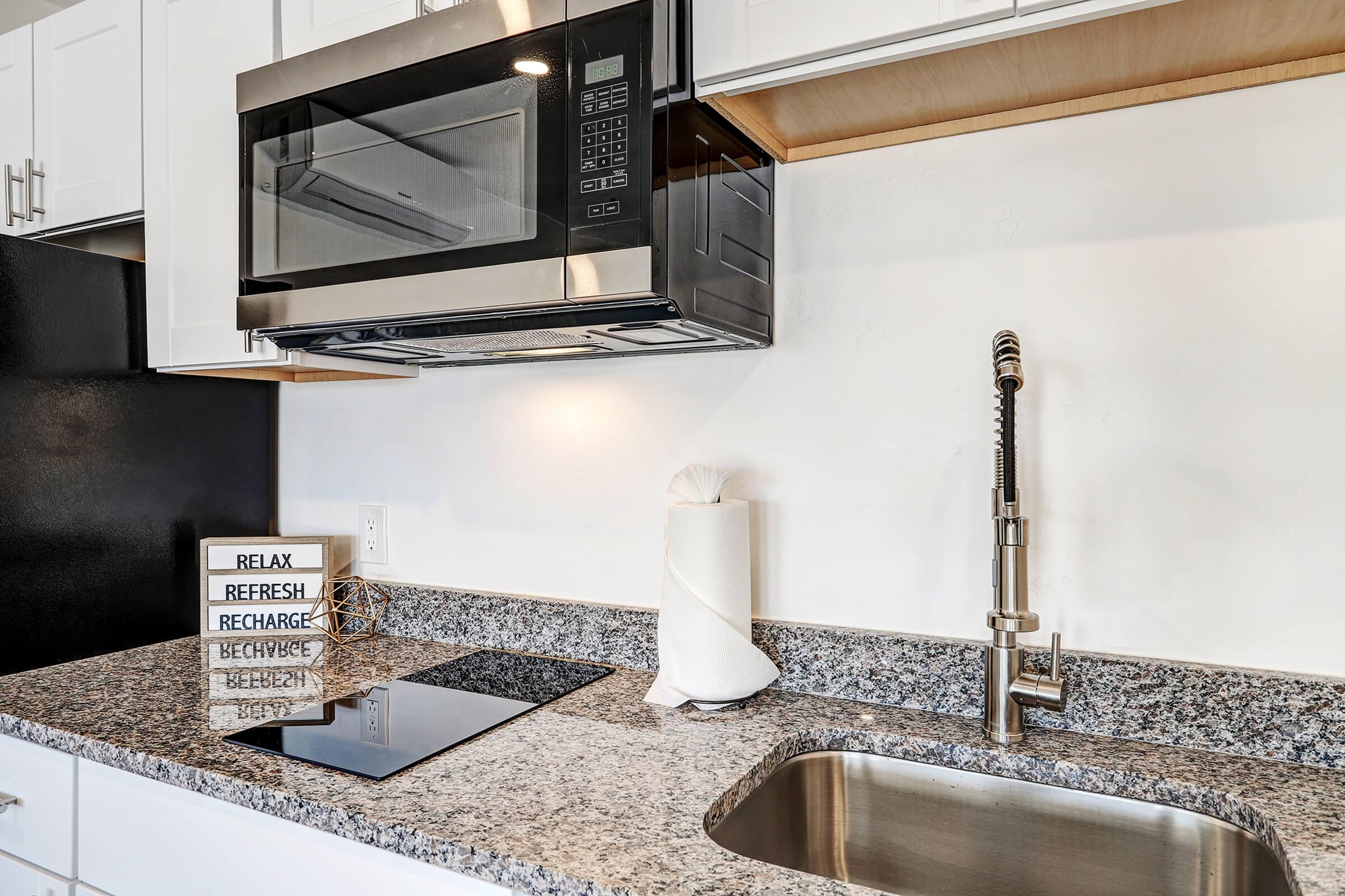 a stove top oven sitting inside of a building