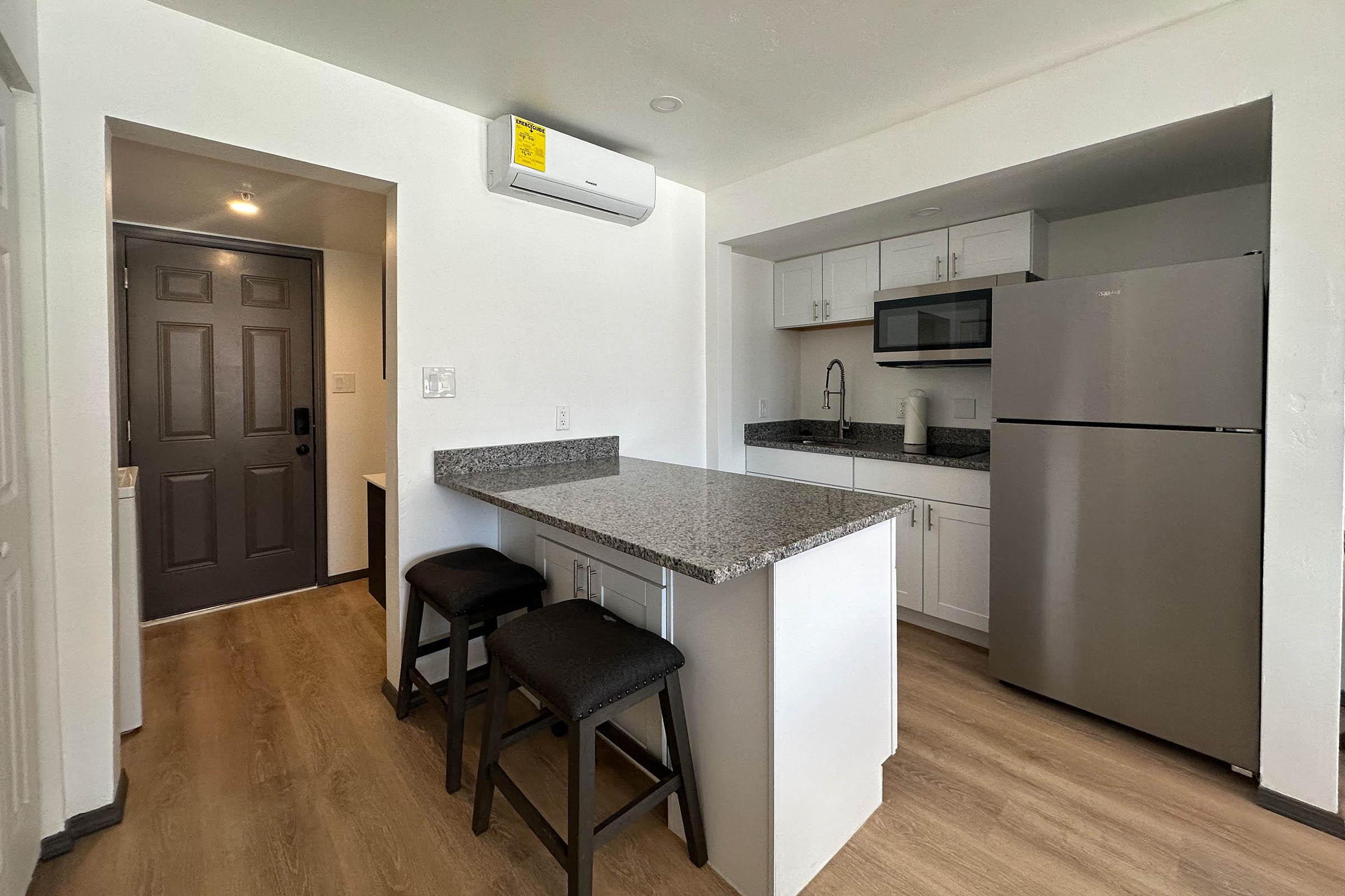 a kitchen with a table in a room