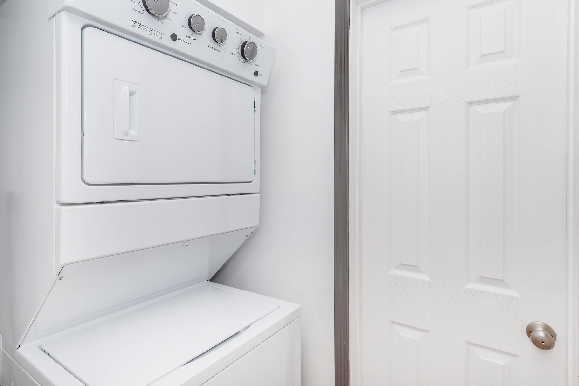 a microwave oven sitting on top of a refrigerator