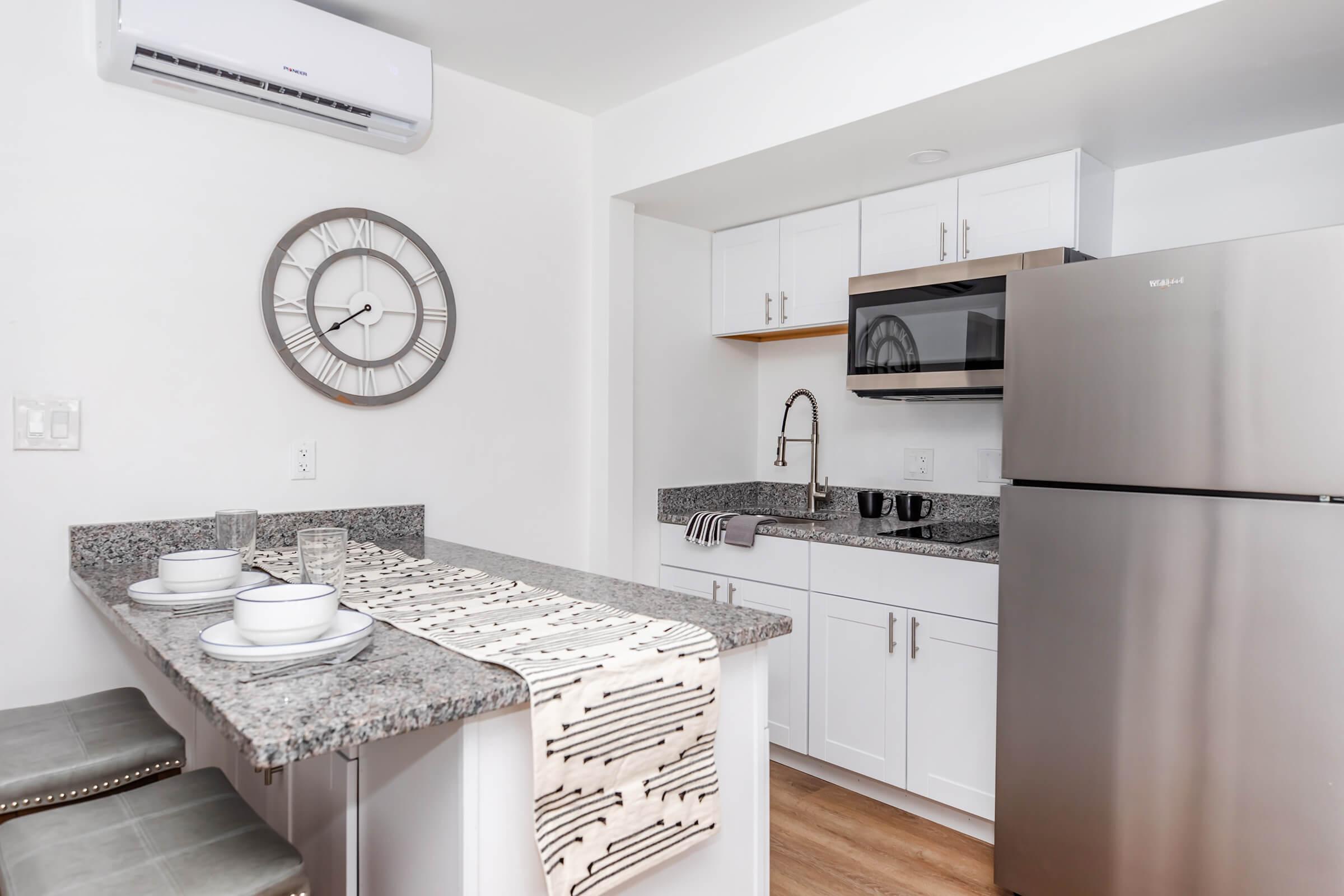 a kitchen with a sink and a refrigerator