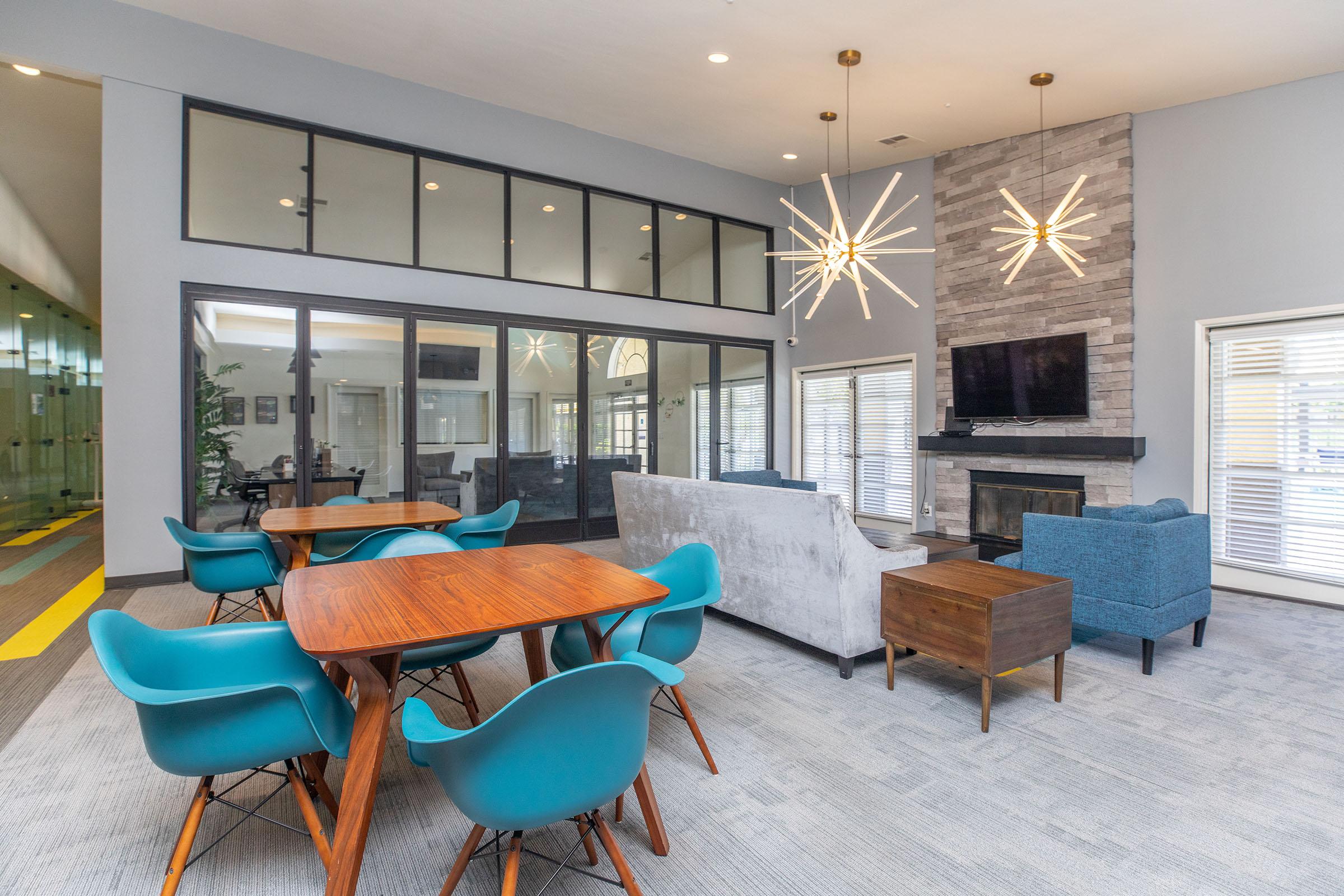 a room filled with furniture and a blue chair