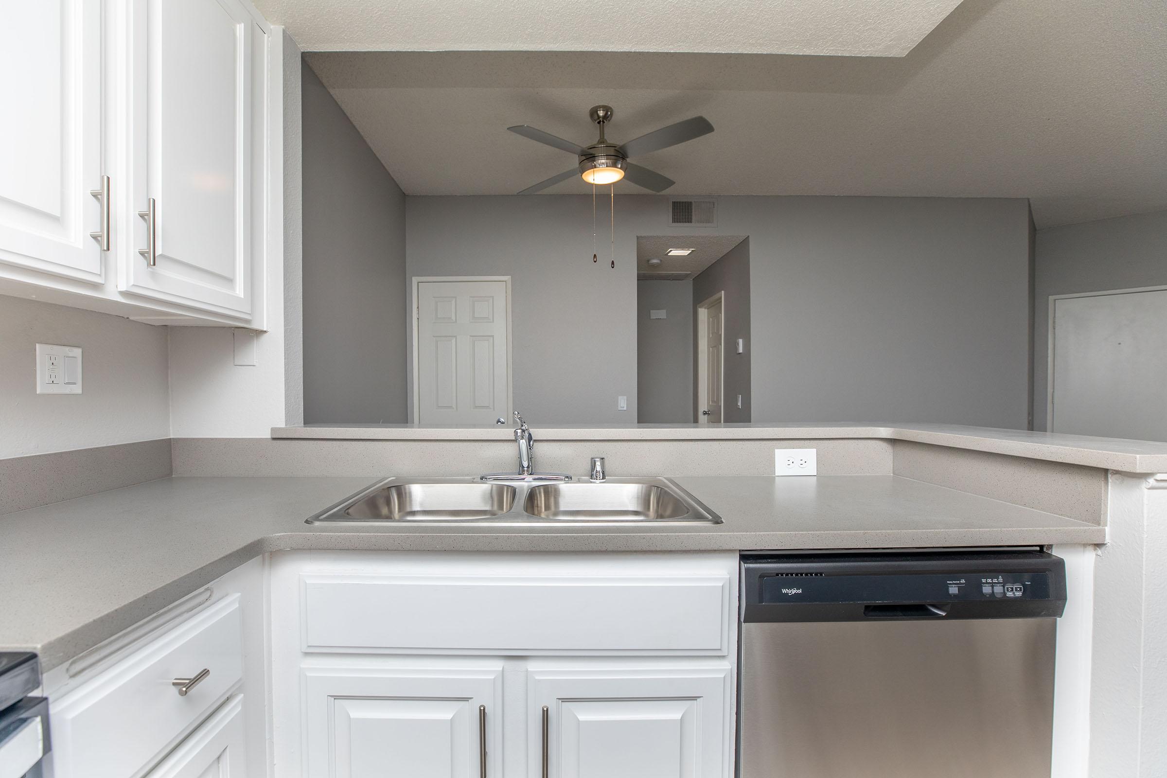 a kitchen with a stove sink and refrigerator