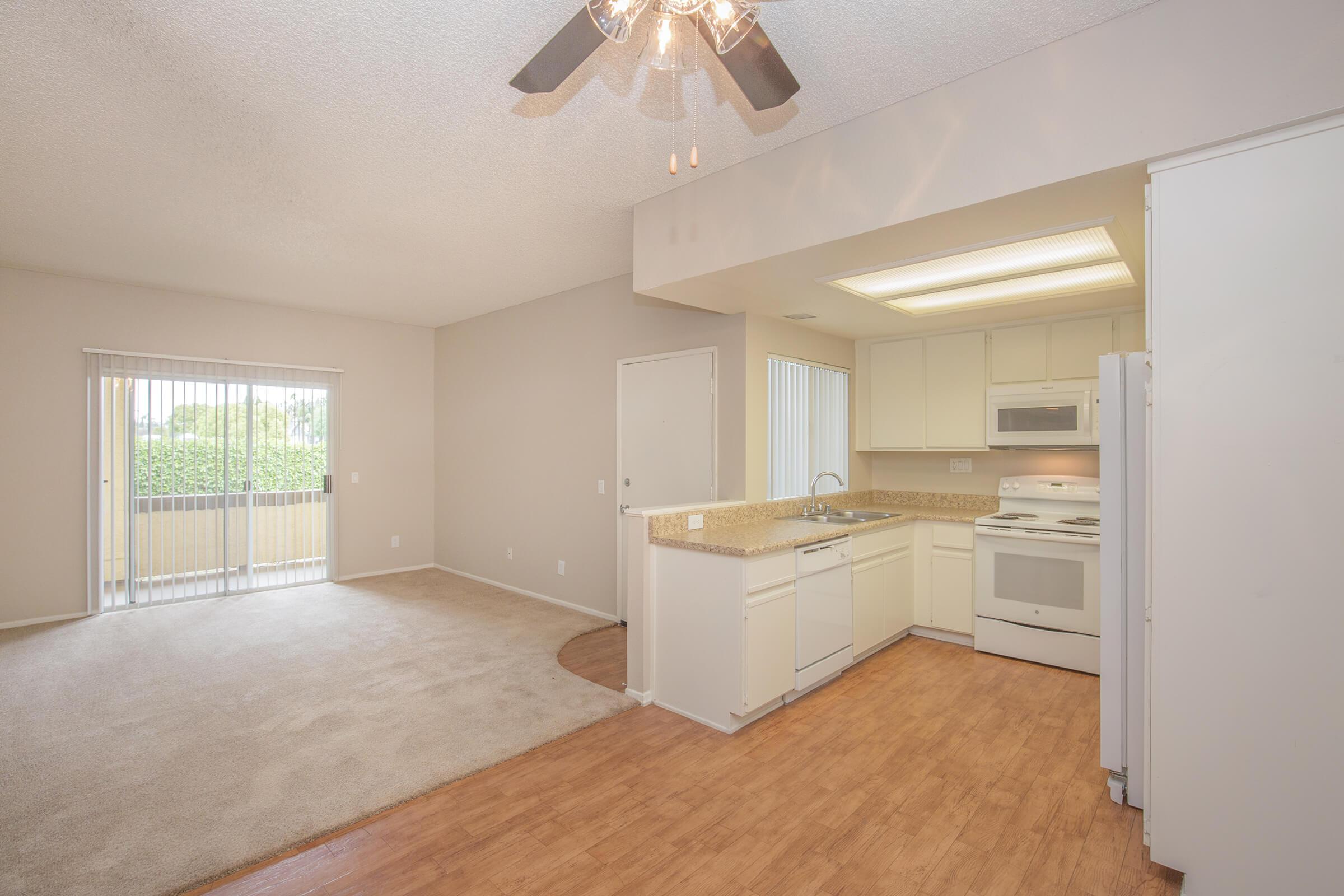 Dining room and kitchen with wooden floors