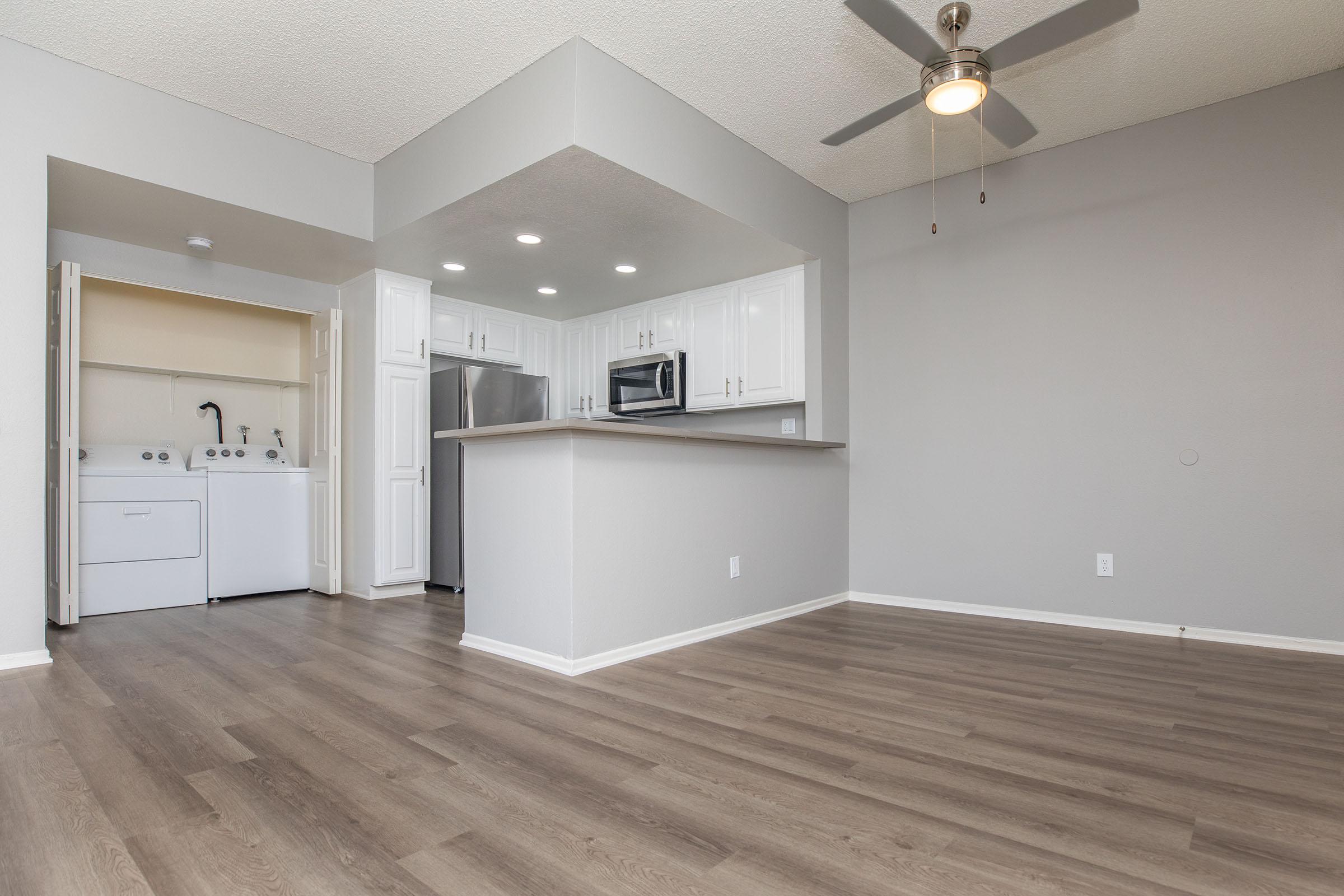 a kitchen with a wooden floor