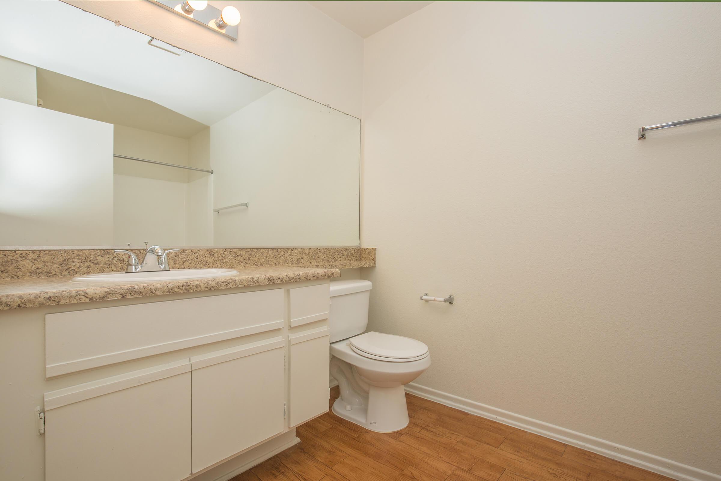 Bathroom with white cabinets