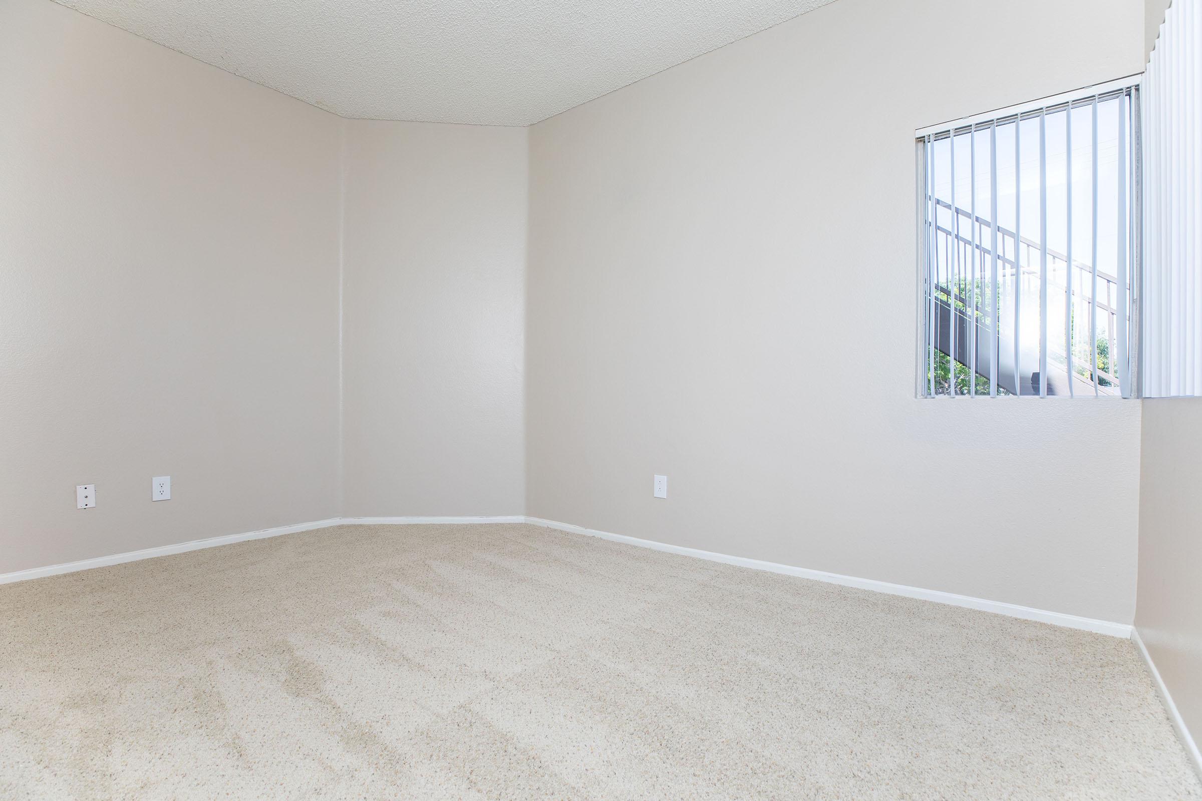 a bedroom with a large mirror