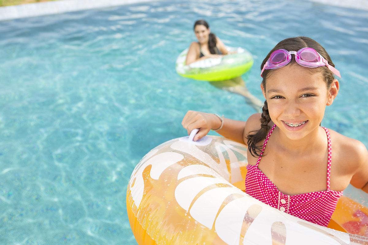 a young girl in a pool of water