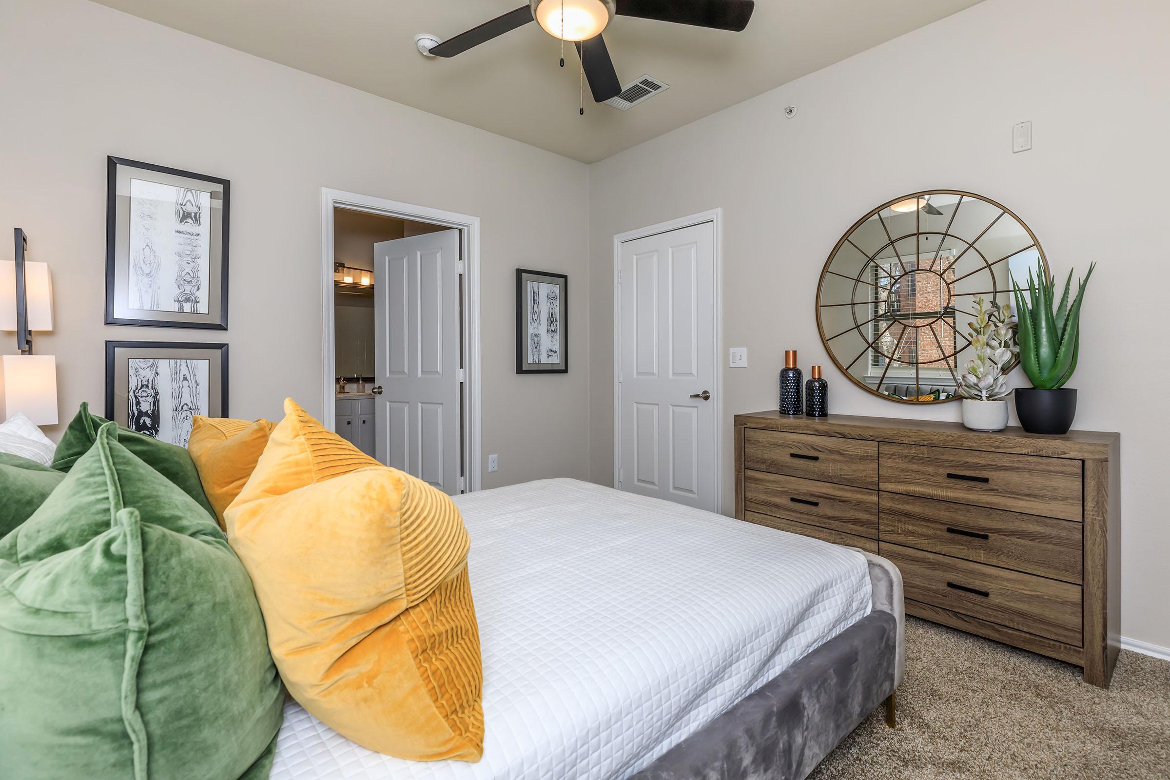 a bedroom with a large bed in a room