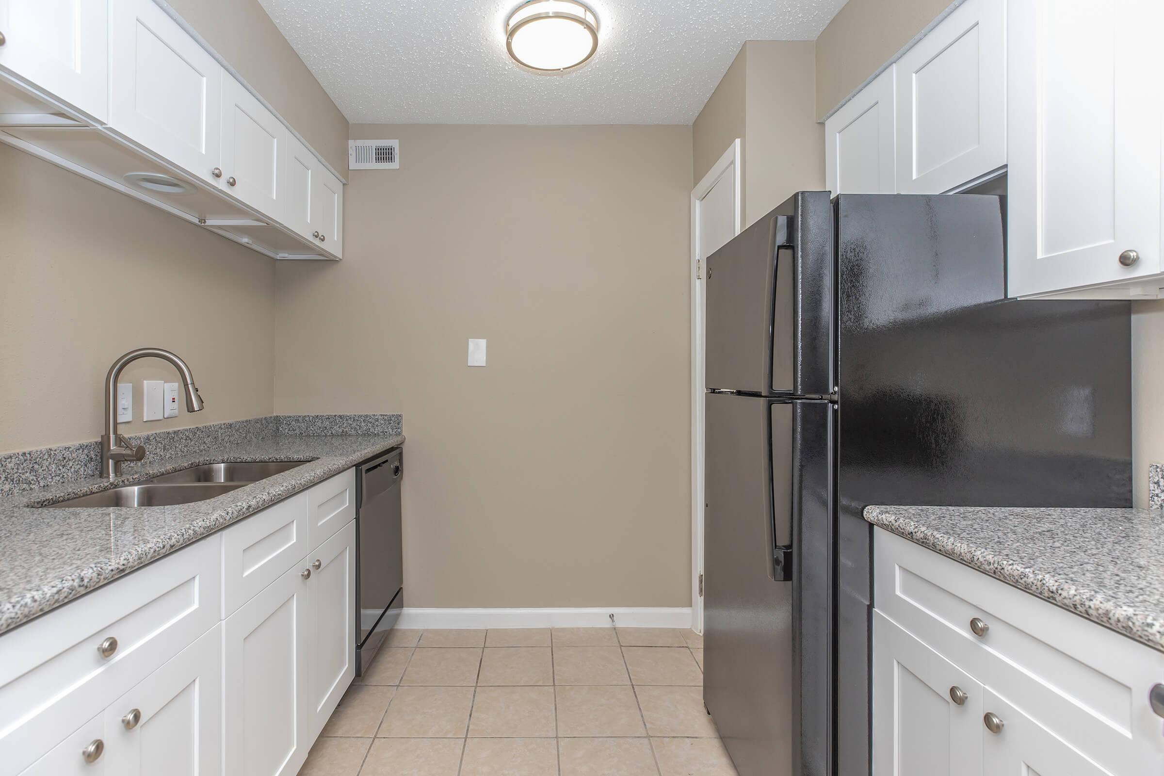 a kitchen with a stove and a sink