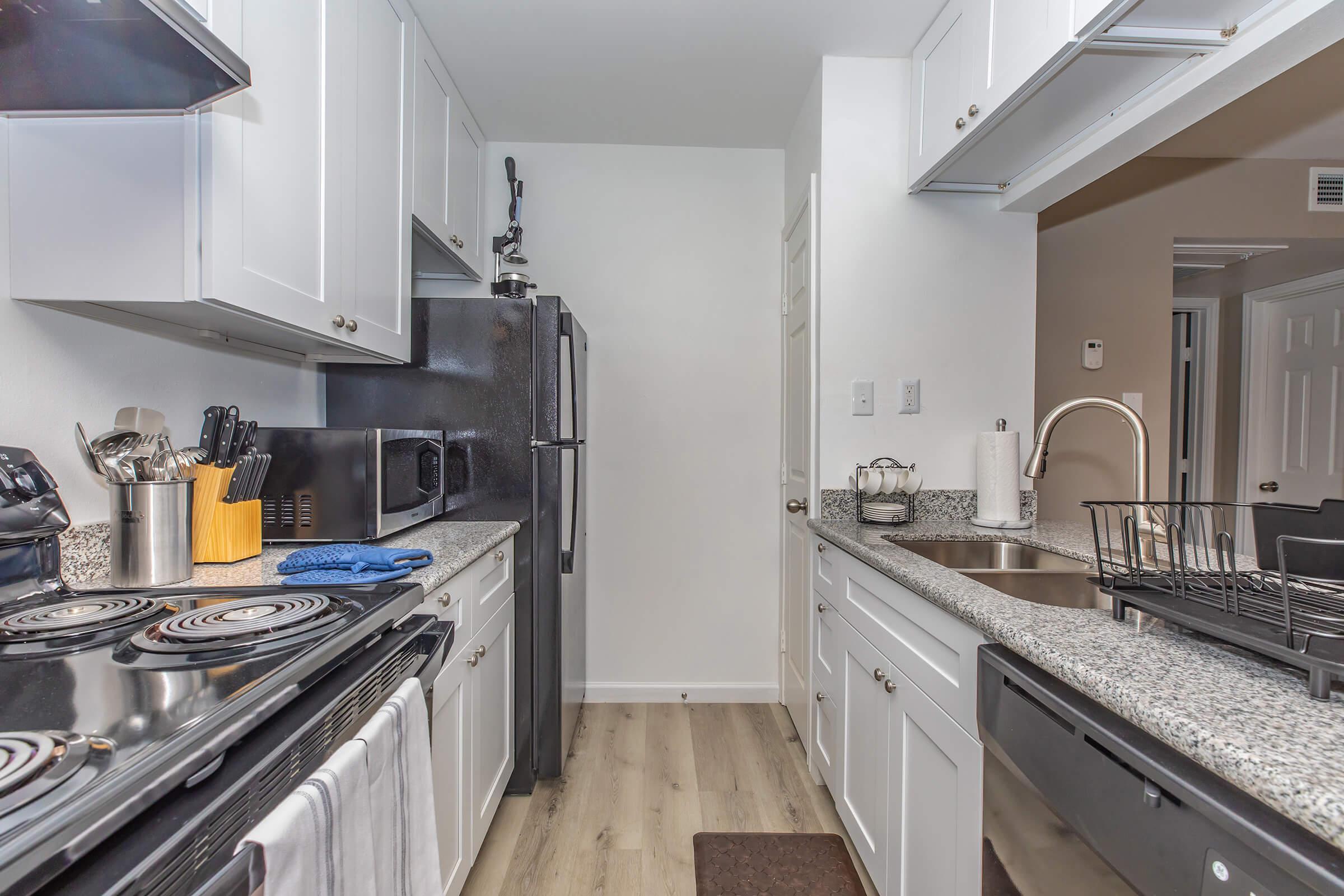 a large kitchen with stainless steel appliances