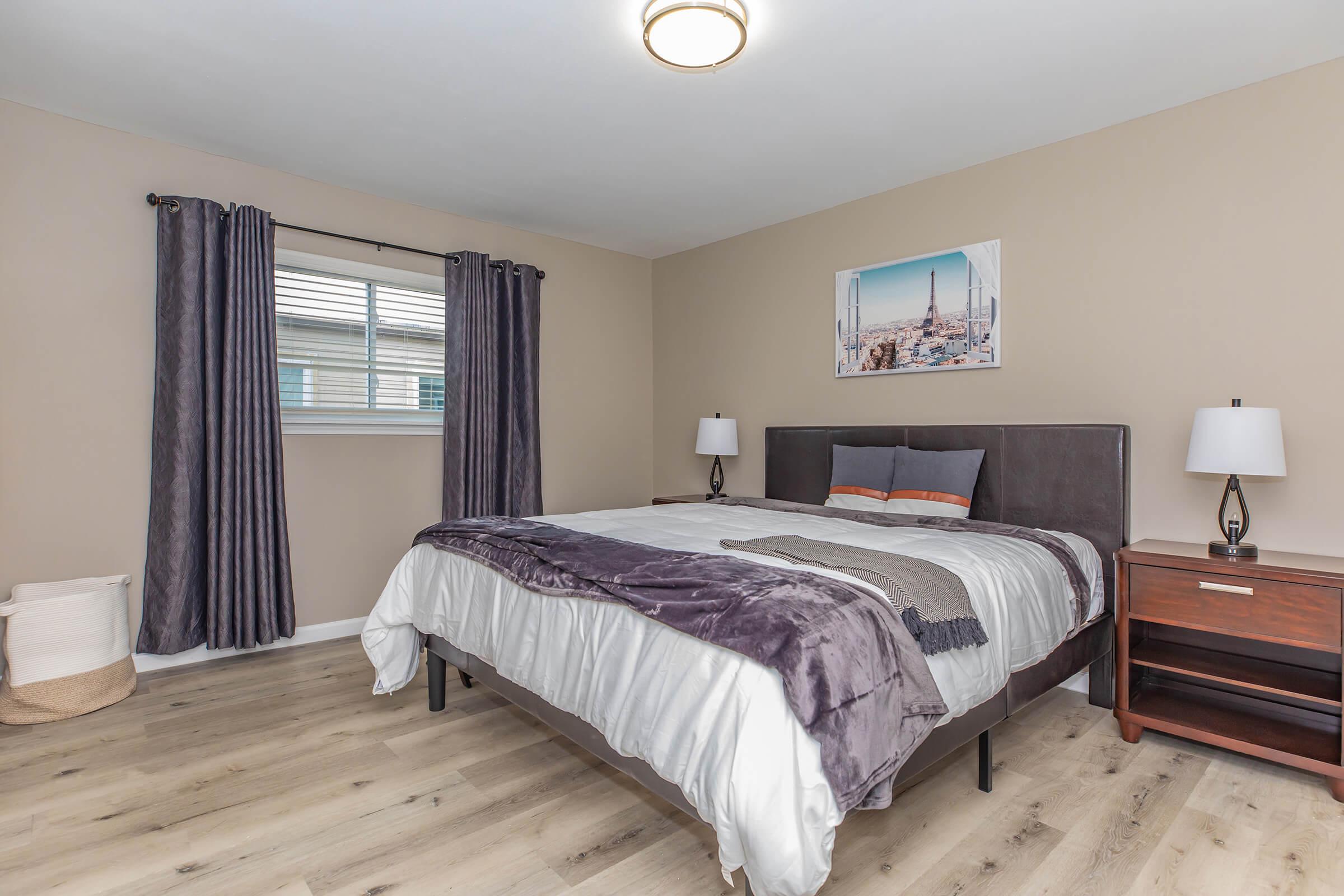 a bedroom with a large bed in a hotel room