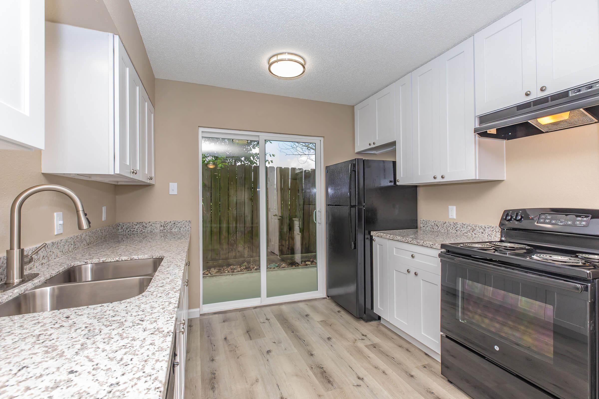 a modern kitchen with stainless steel appliances