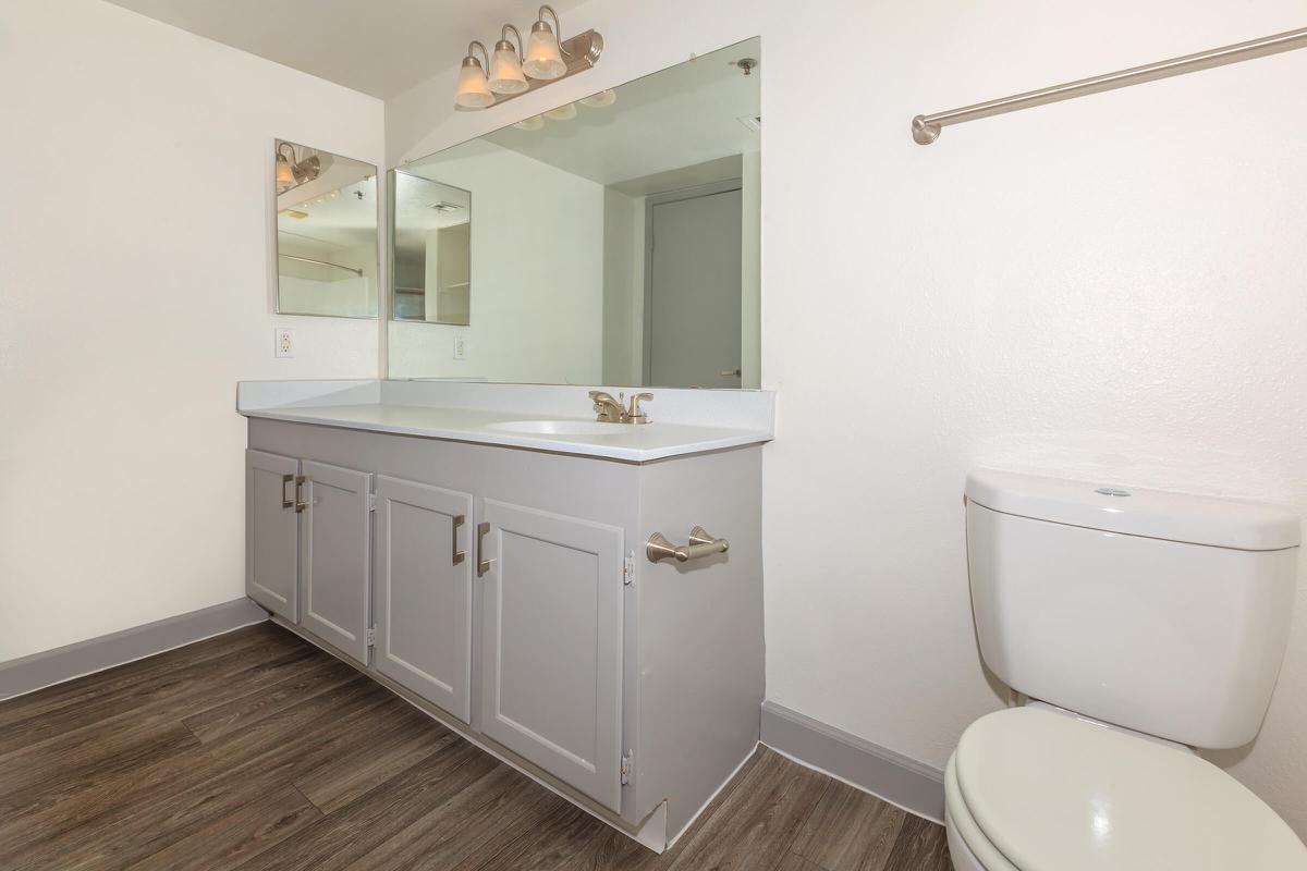 a white tub sitting next to a sink