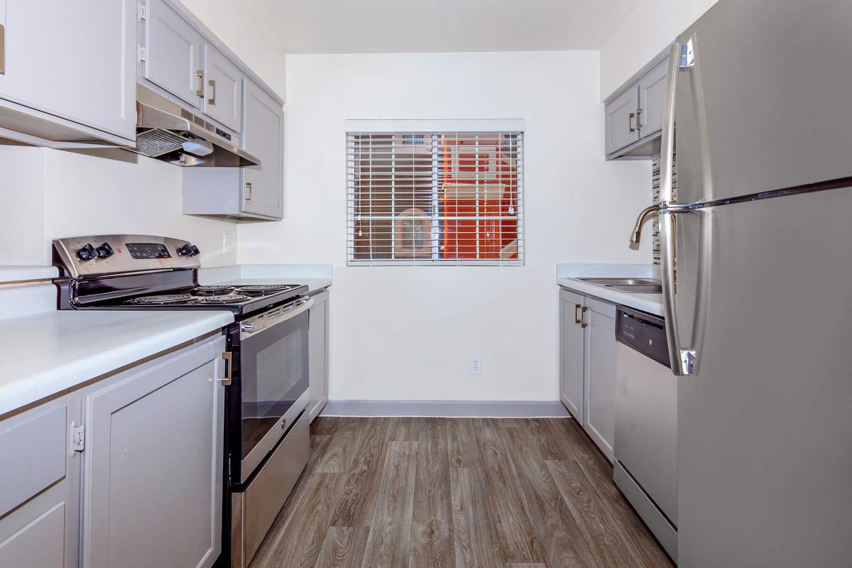 a kitchen with a stove top oven sitting inside of a refrigerator