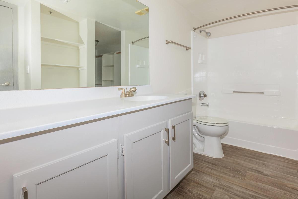 a large white tub sitting next to a sink