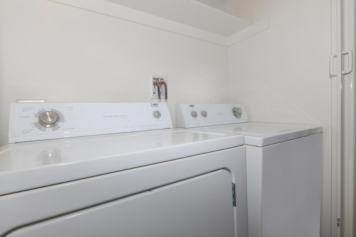 a white refrigerator freezer sitting inside of a kitchen