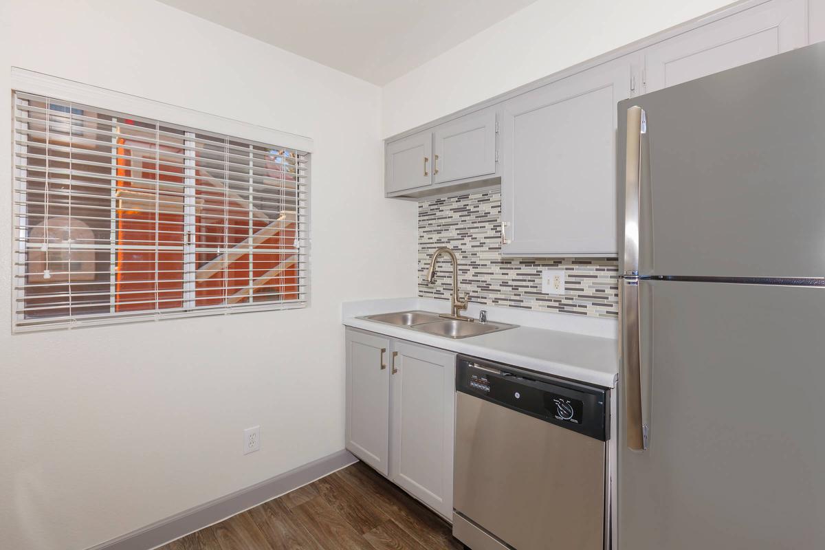a kitchen with a stove top oven sitting inside of a refrigerator