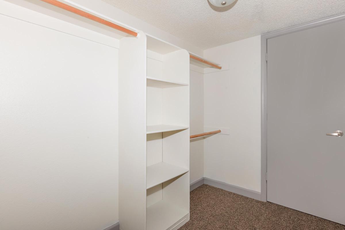 a large white refrigerator in a small room