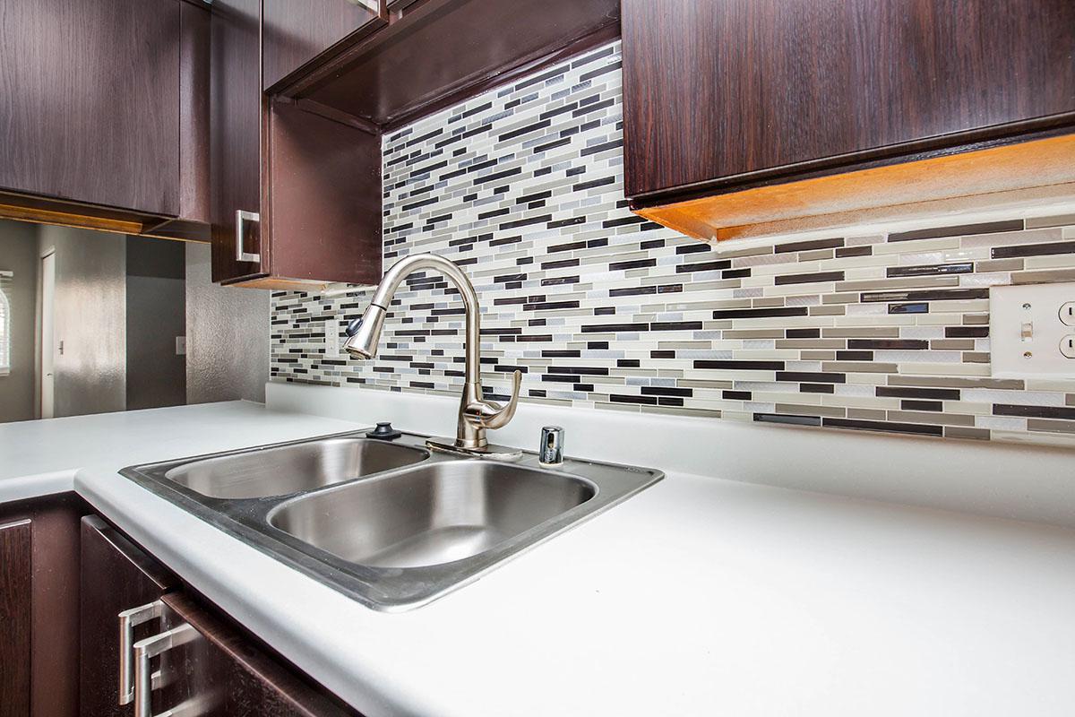 a kitchen with a stove and a sink