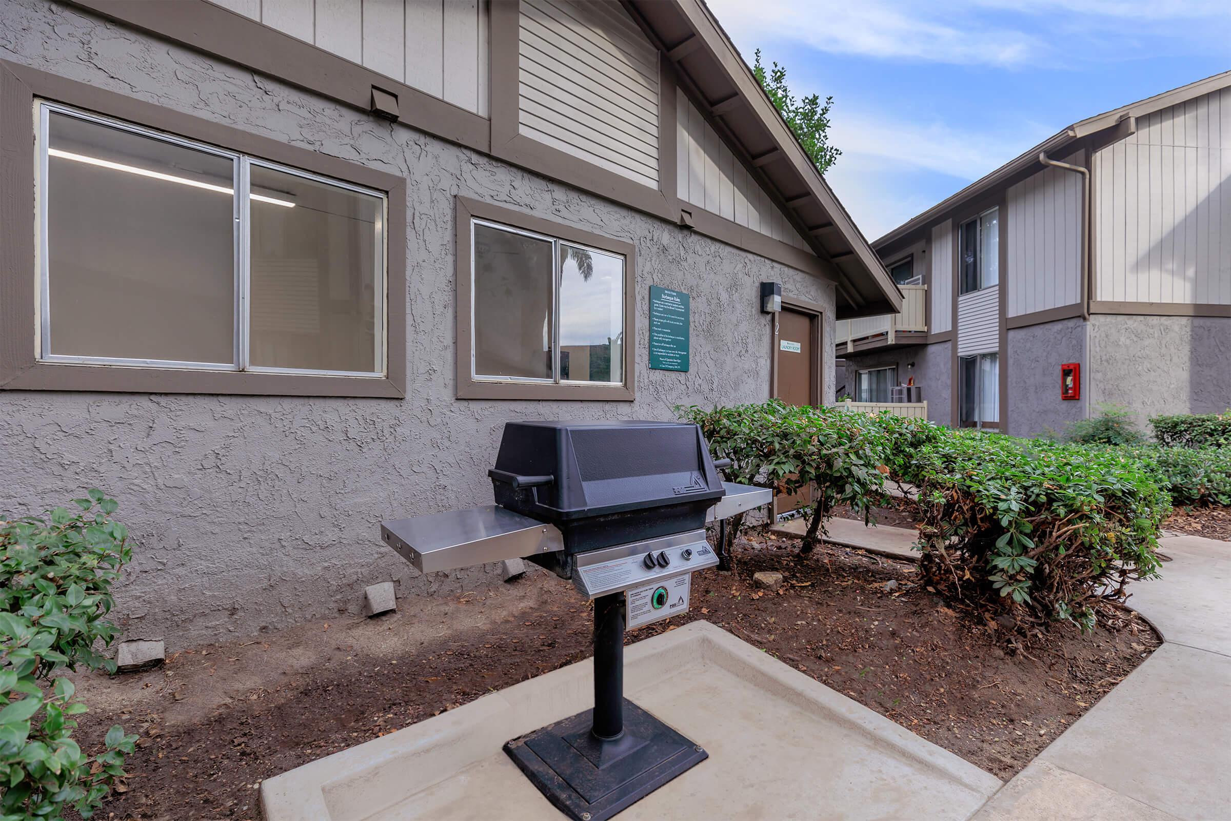 Barbecue next to community laundry room