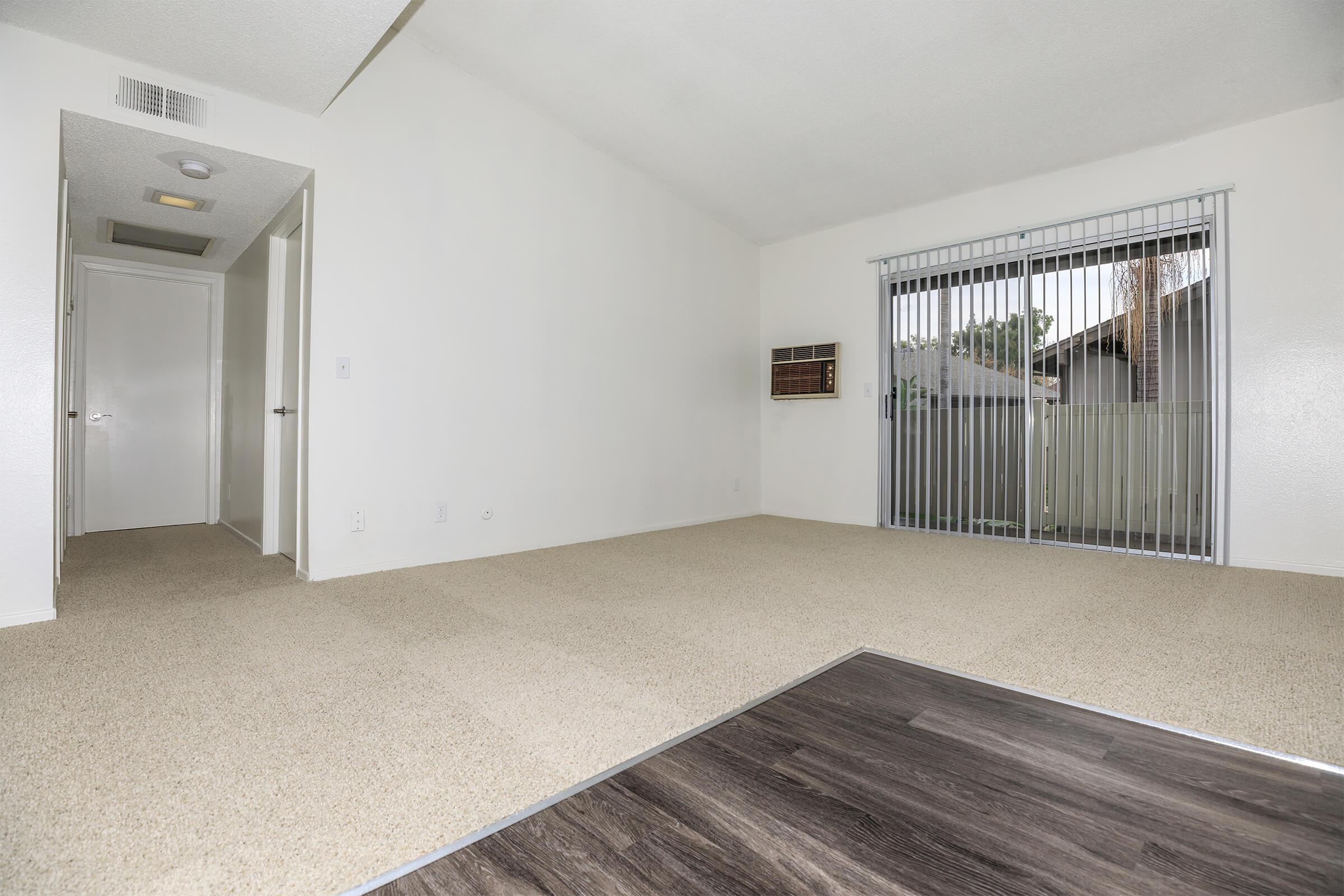 Unfurnished living room with carpet