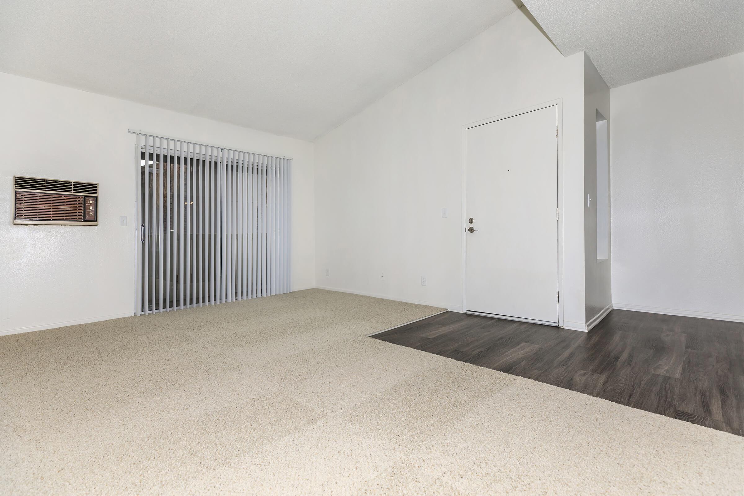 Unfurnished living room with sliding glass doors