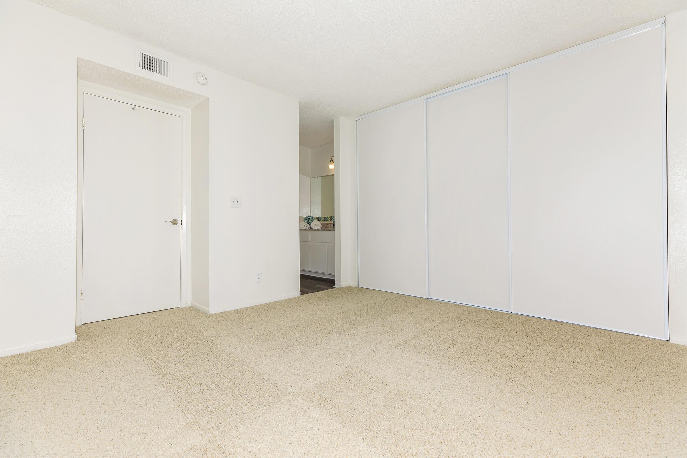 Unfurnished bedroom with carpet