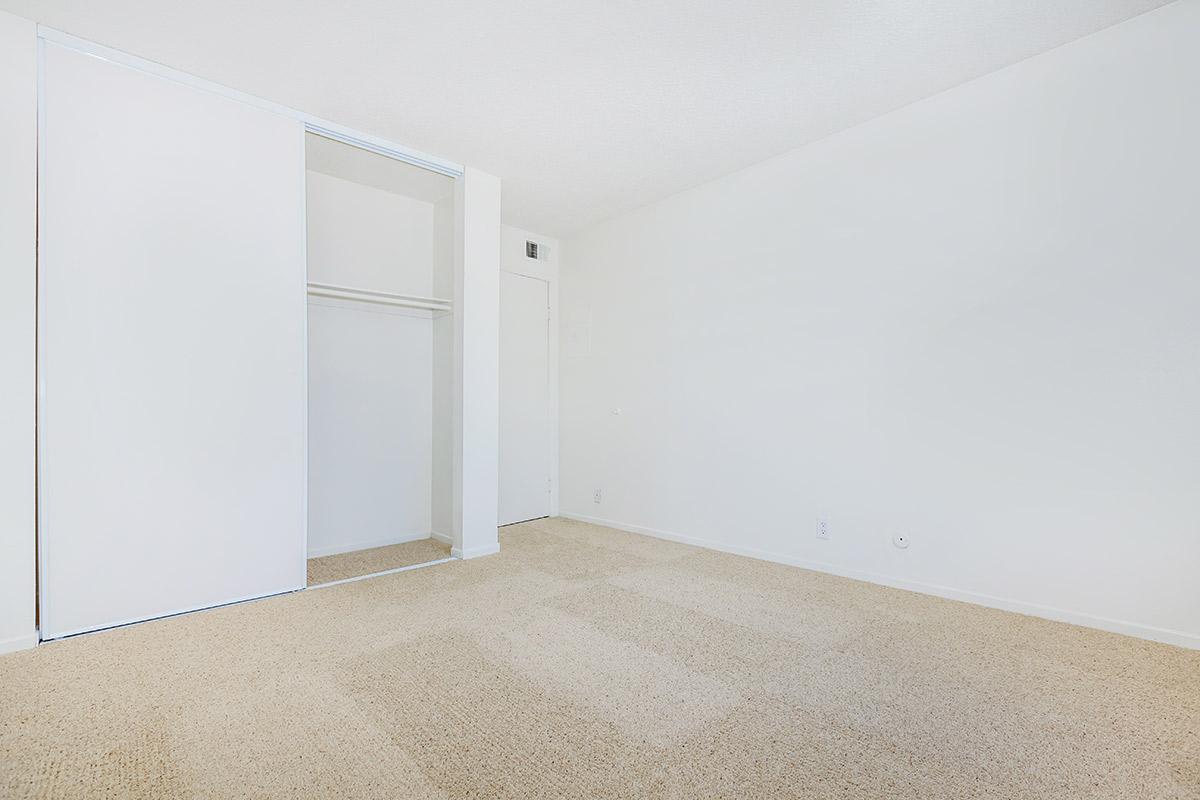 Bedroom with open sliding closet door